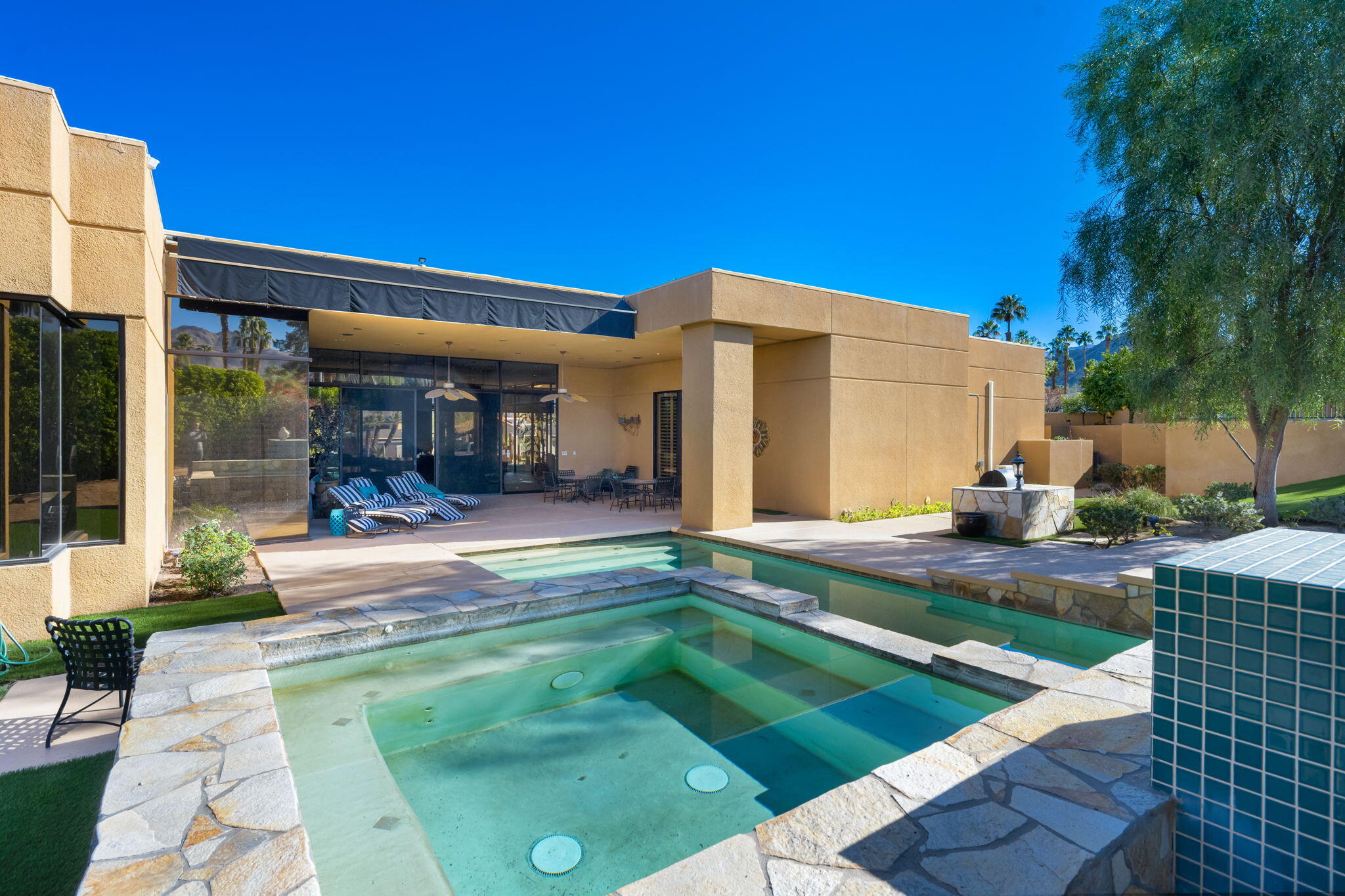73380 Agave Lane Palm Desert, CA 92260 - Photo 49 of 81 a view of a house with backyard patio and swimming pool