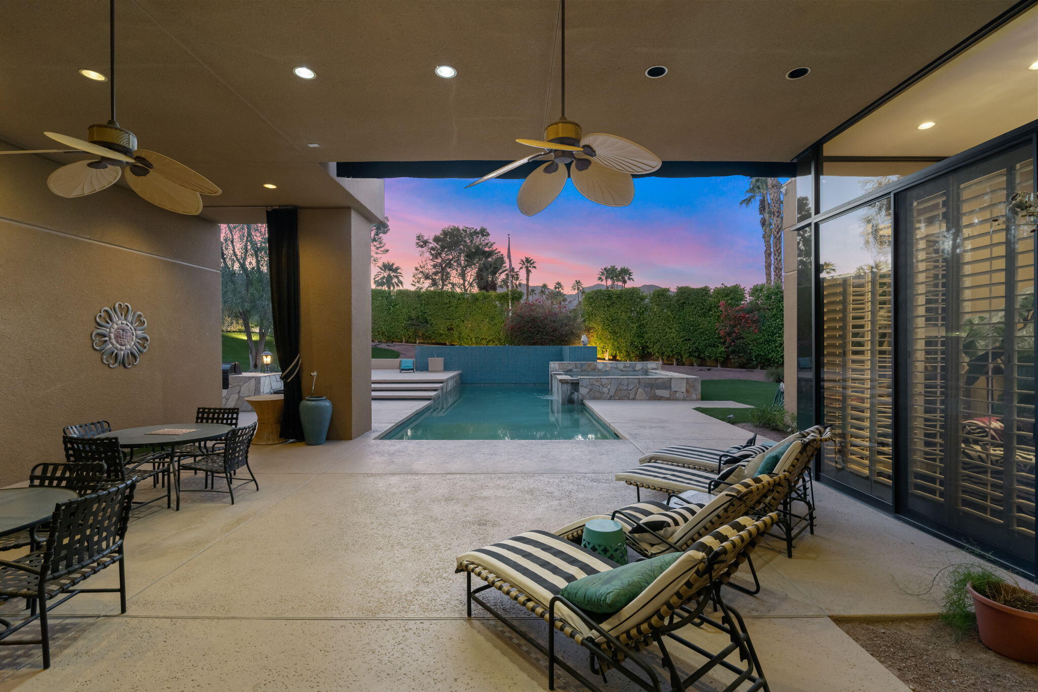 73380 Agave Lane Palm Desert, CA 92260 - Photo 53 of 81 a view of an chairs and tables in patio
