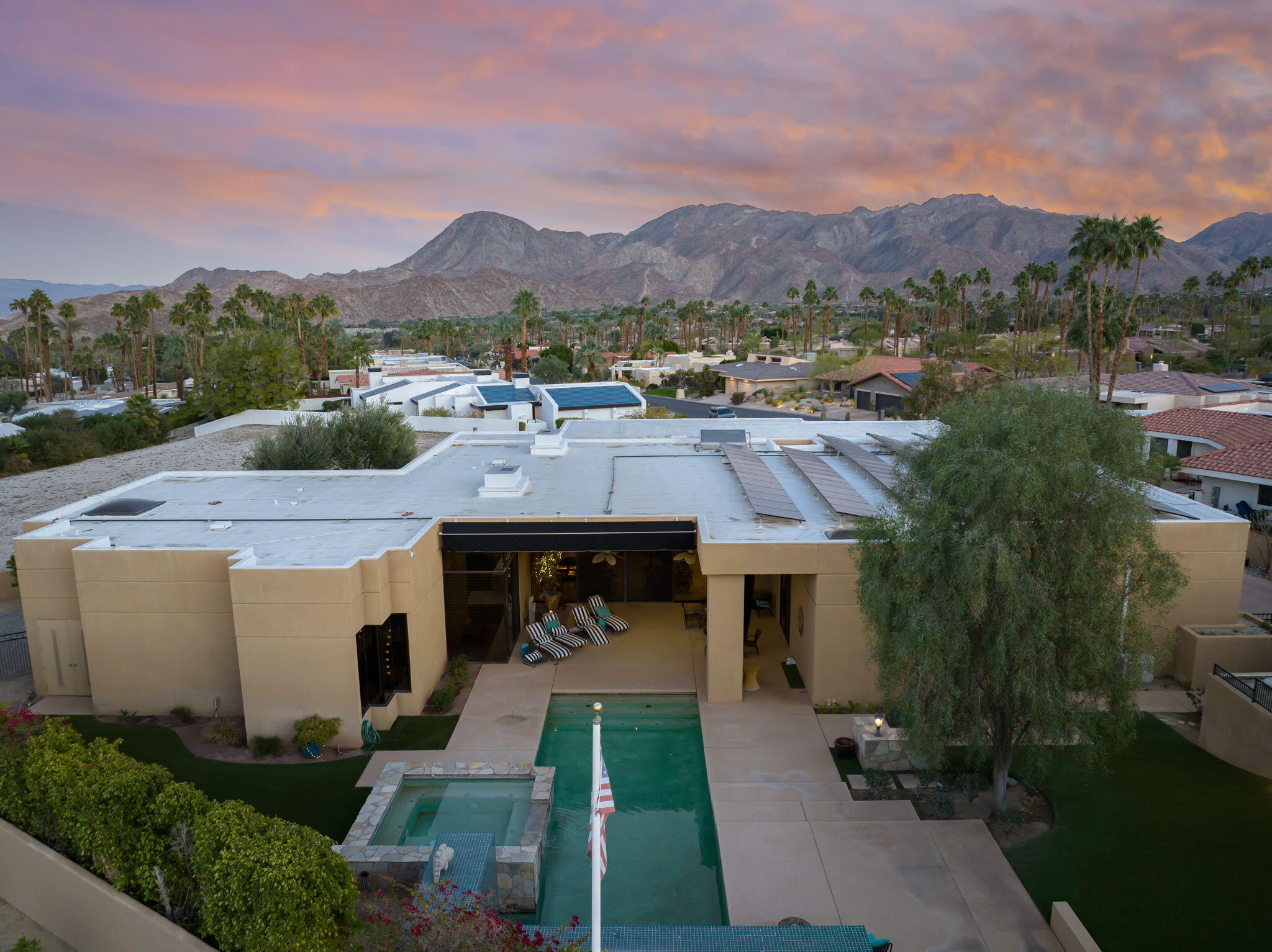 73380 Agave Lane Palm Desert, CA 92260 - Photo 59 of 81 a aerial view of a house with a yard swimming pool and mountain view in back