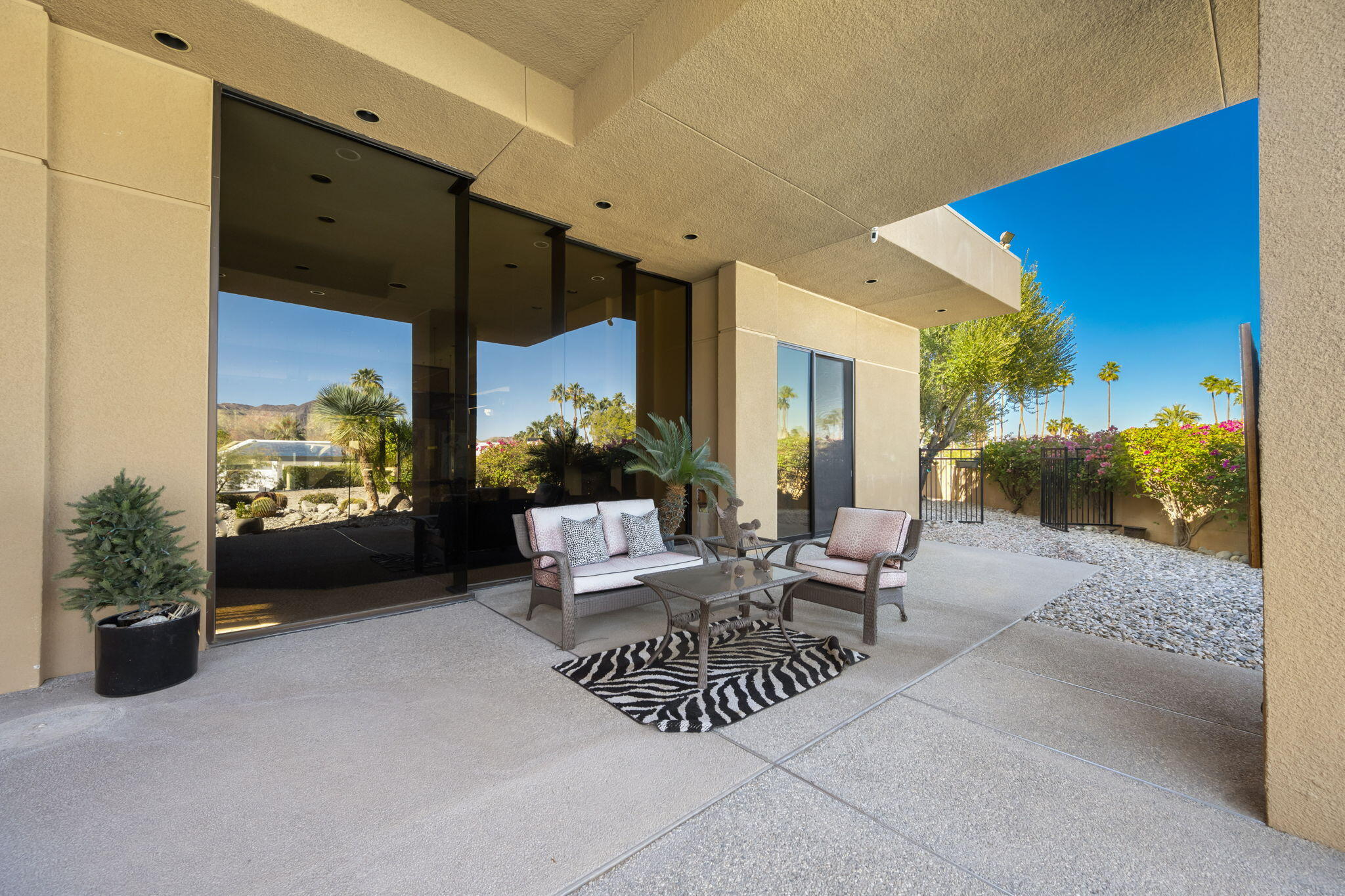73380 Agave Lane Palm Desert, CA 92260 - Photo 72 of 81 a view of a patio with couches and potted plants