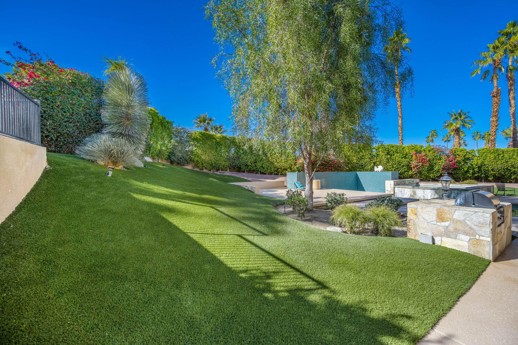 73380 Agave Lane Palm Desert, CA 92260 - Photo 73 of 81 a view of a garden with a lake