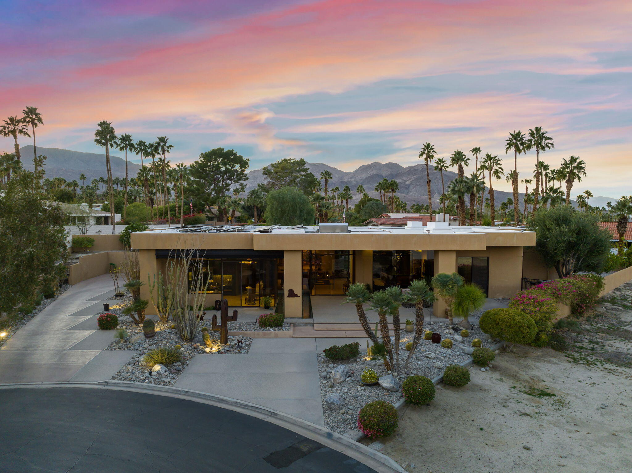 73380 Agave Lane Palm Desert, CA 92260 - Photo 80 of 81 a view of a patio with table and chairs couches under an umbrella