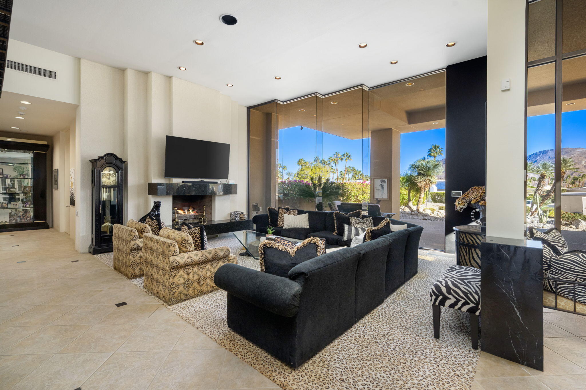 73380 Agave Lane Palm Desert, CA 92260 - Photo 9 of 81 a living room with fireplace furniture and a flat screen tv
