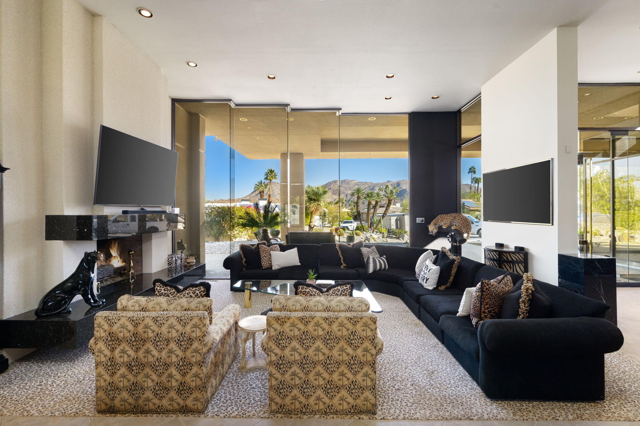 73380 Agave Lane Palm Desert, CA 92260 - Photo 10 of 81 a living room with furniture flat screen tv and a large window
