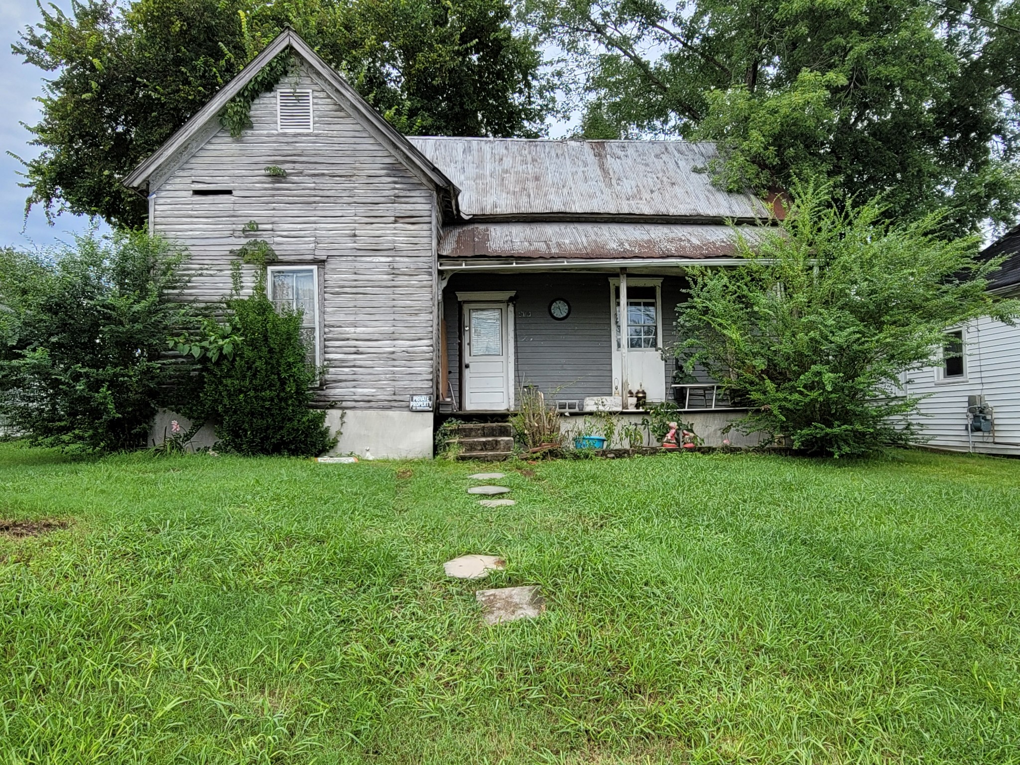 310 Clark Street Sparta, TN 38583 - Photo 1 of 1 a front view of a house with a yard and trees