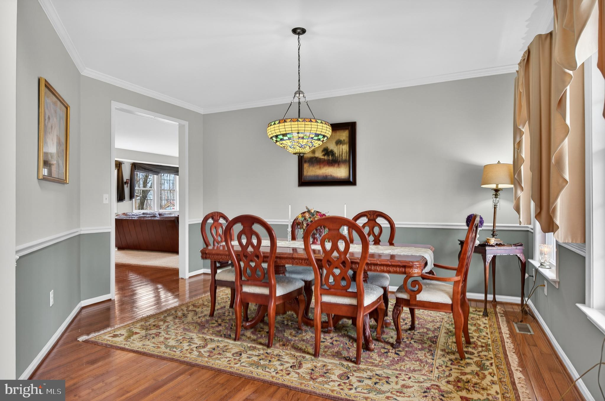 5777 White Rock Road Sykesville, MD 21784 - Photo 13 of 42 a dining room with furniture a rug and wooden floor