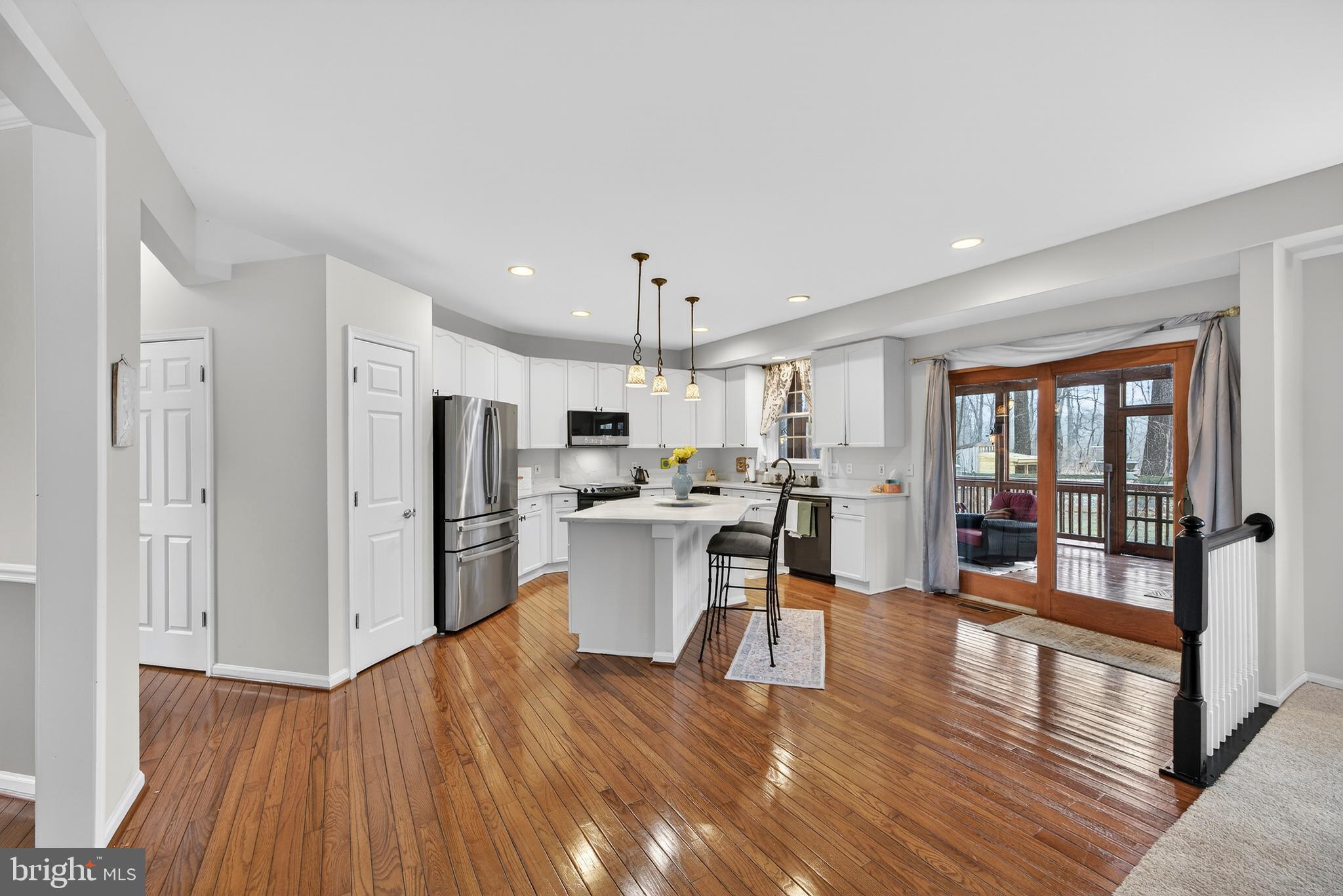 5777 White Rock Road Sykesville, MD 21784 - Photo 16 of 42 a kitchen with white cabinets and stainless steel appliances