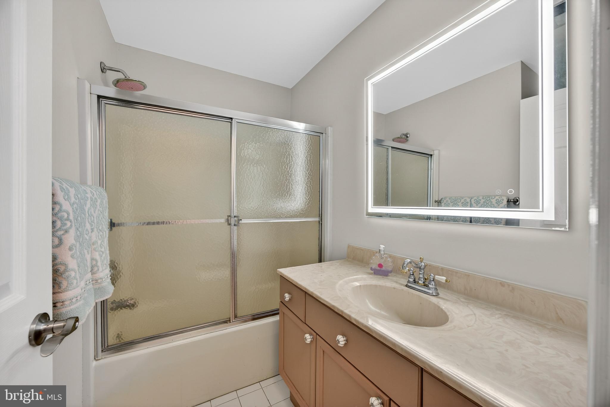 5777 White Rock Road Sykesville, MD 21784 - Photo 28 of 42 a bathroom with a sink and mirror with shower