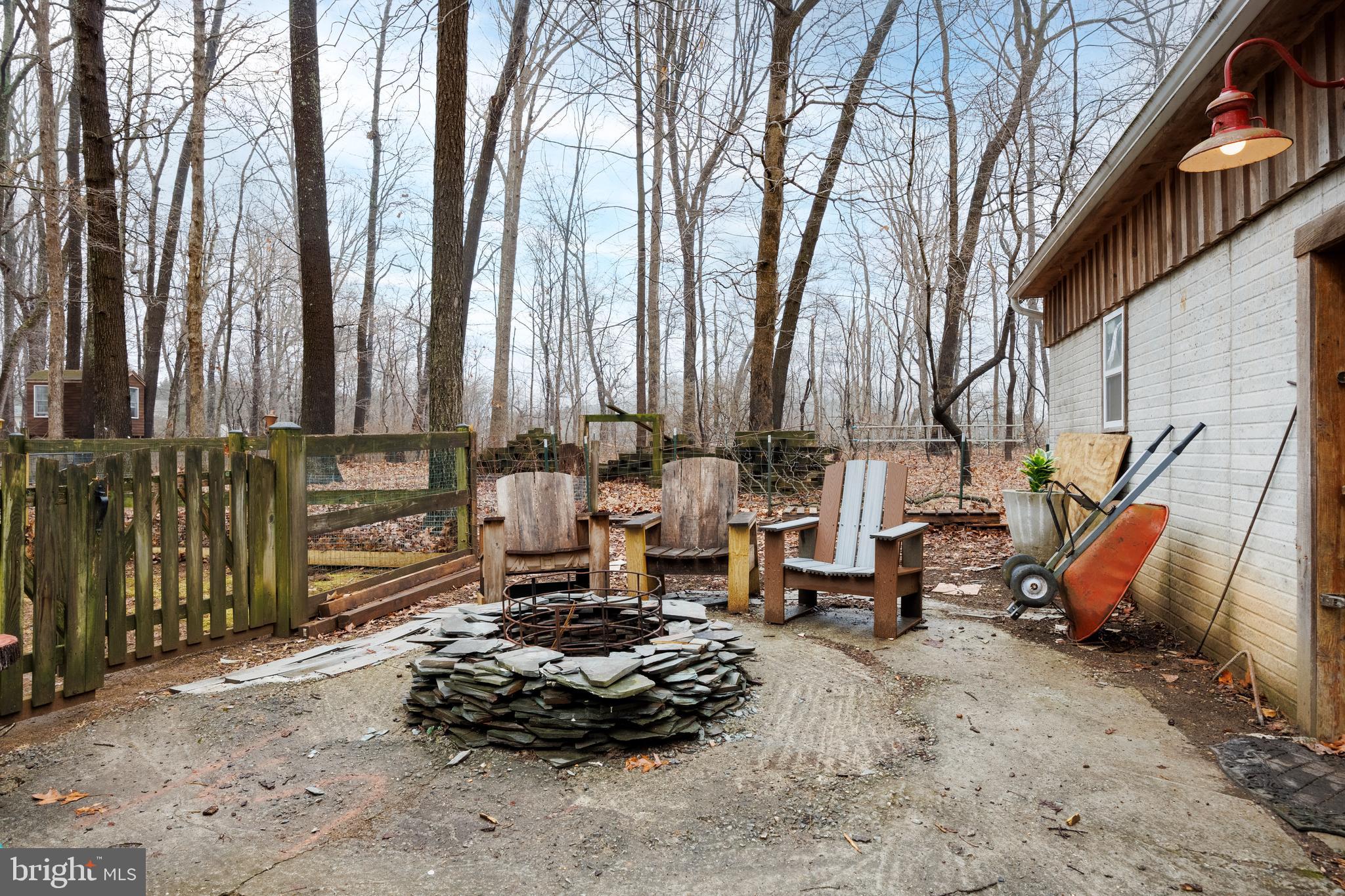 5777 White Rock Road Sykesville, MD 21784 - Photo 36 of 42 a backyard of a house with barbeque oven table and chairs