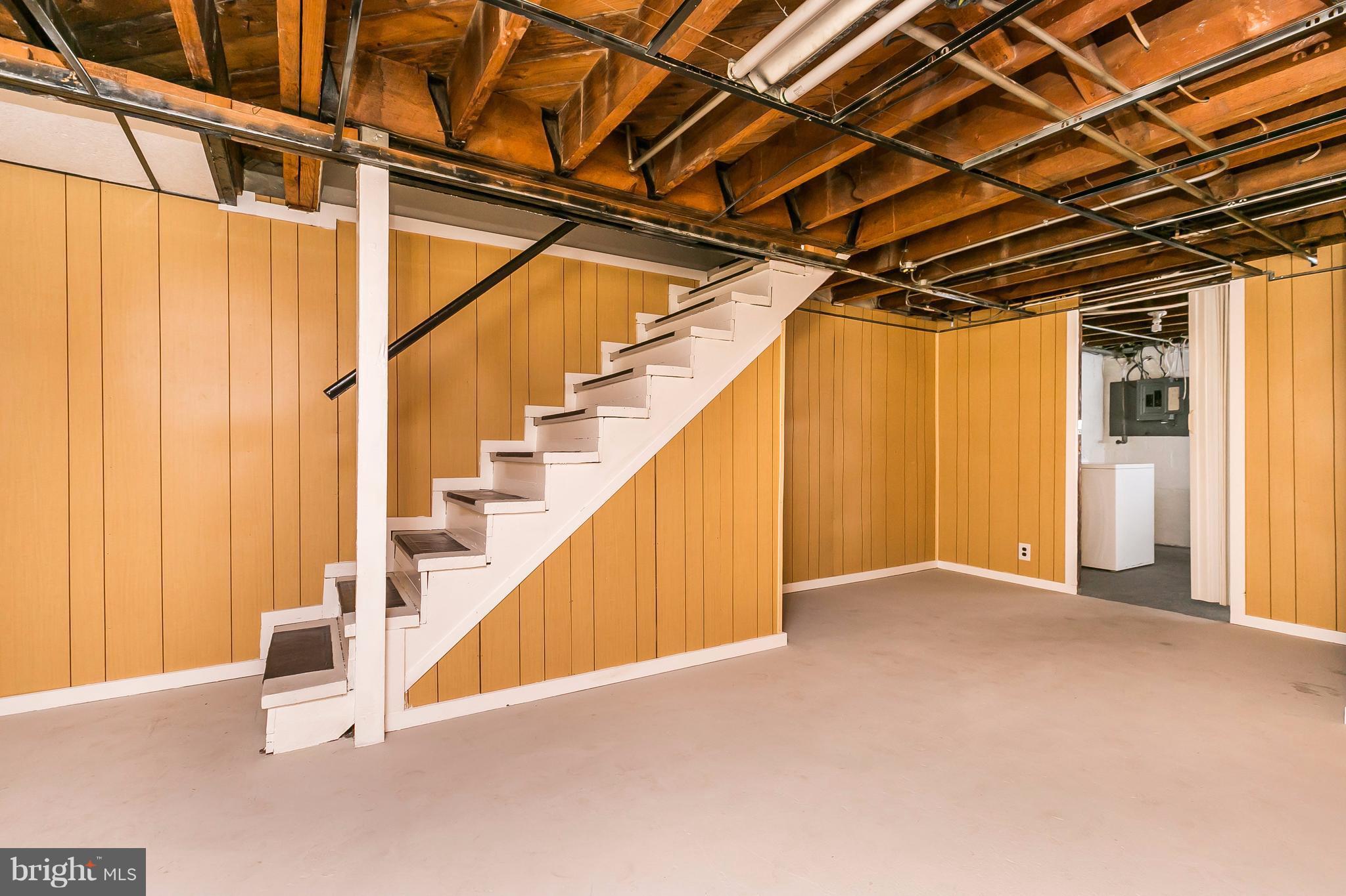 4016 Rexmere Road Baltimore, MD 21218 - Photo 18 of 26 a view of an empty room with stairs