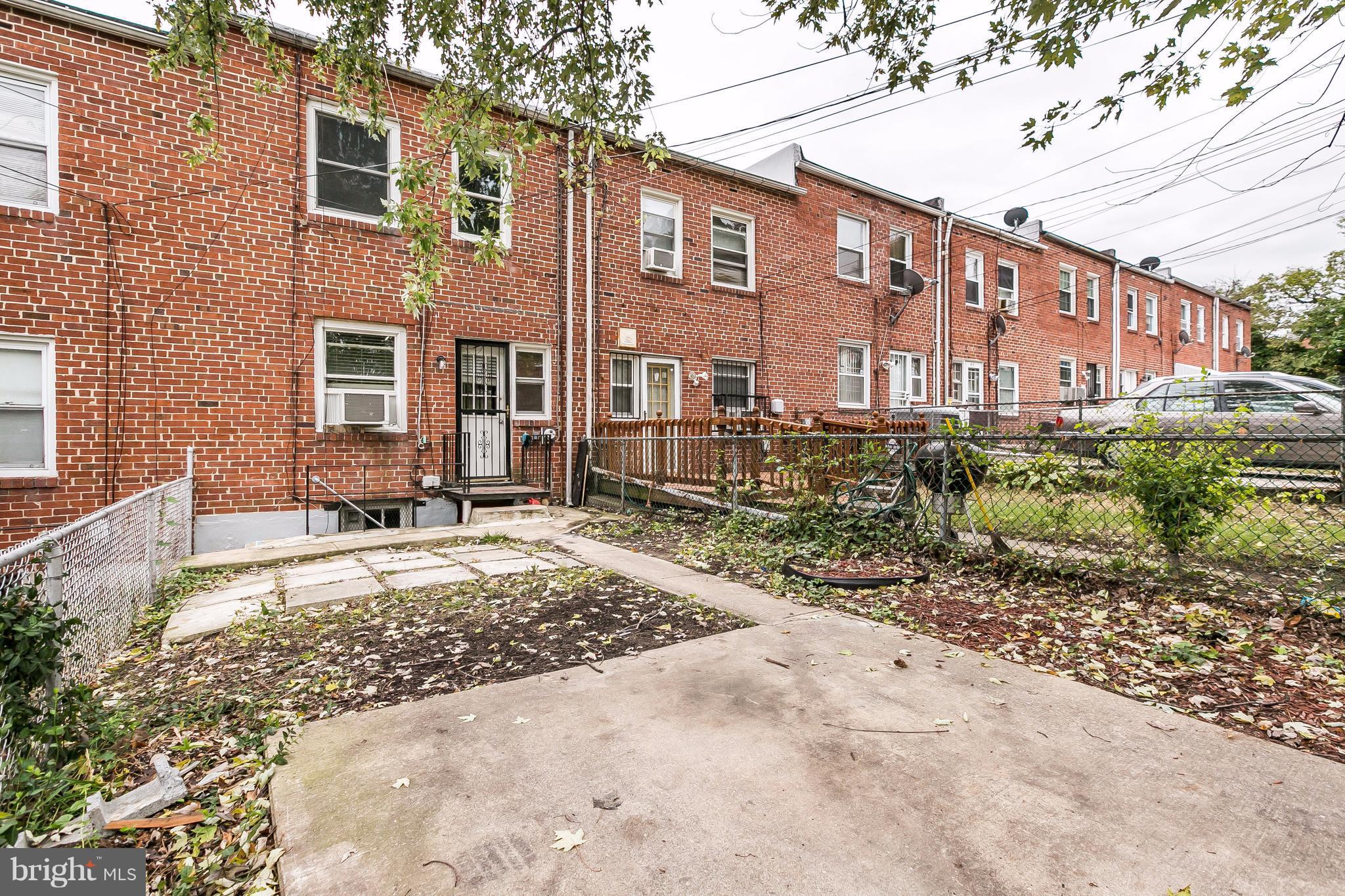 4016 Rexmere Road Baltimore, MD 21218 - Photo 23 of 26 a view of a building with a yard