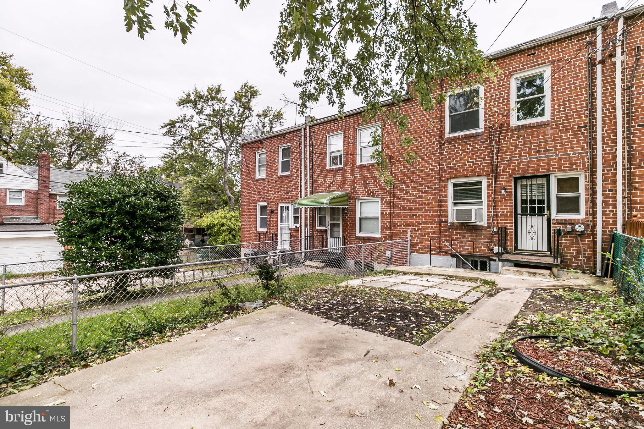 4016 Rexmere Road Baltimore, MD 21218 - Photo 24 of 26 a front view of a house with garden