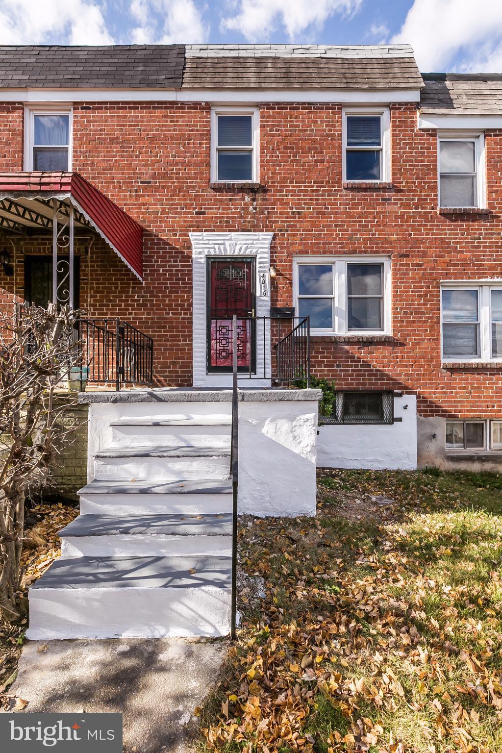 4016 Rexmere Road Baltimore, MD 21218 - Photo 25 of 26 a front view of a house with stairs