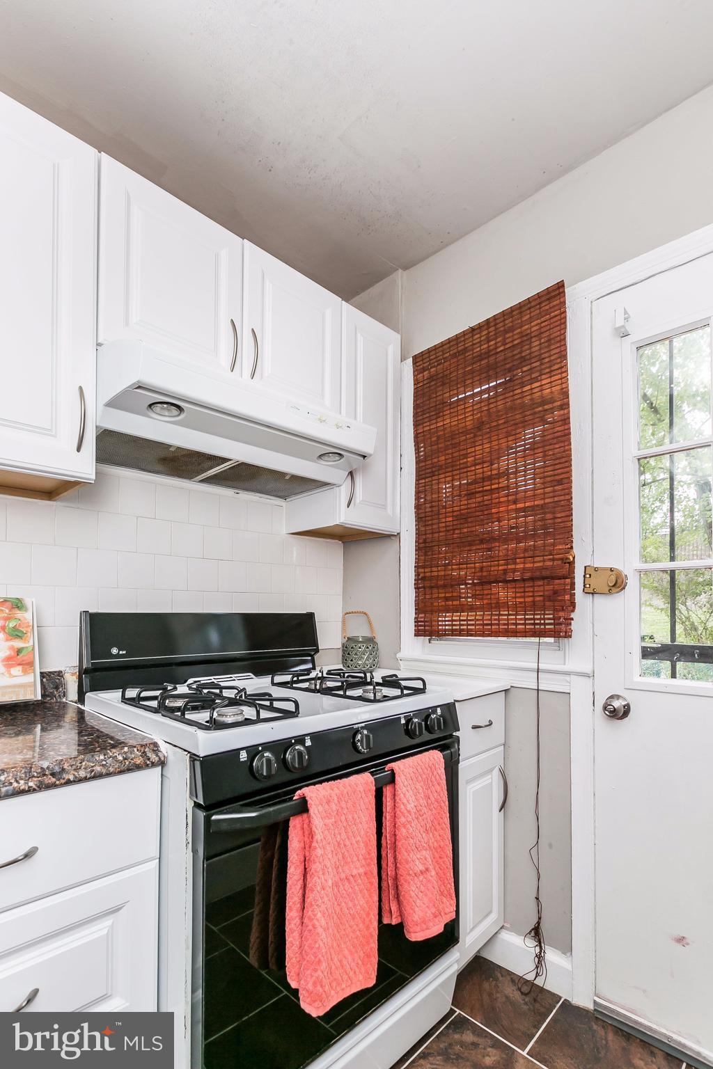 4016 Rexmere Road Baltimore, MD 21218 - Photo 8 of 26 a kitchen with stainless steel appliances granite countertop a stove a sink and a microwave
