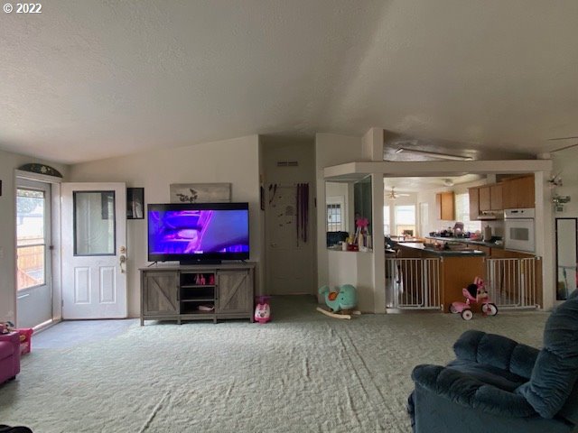 3425 Northeast Riverside Avenue Pendleton, OR 97801 - Photo 8 of 25 a living room with furniture and a flat screen tv