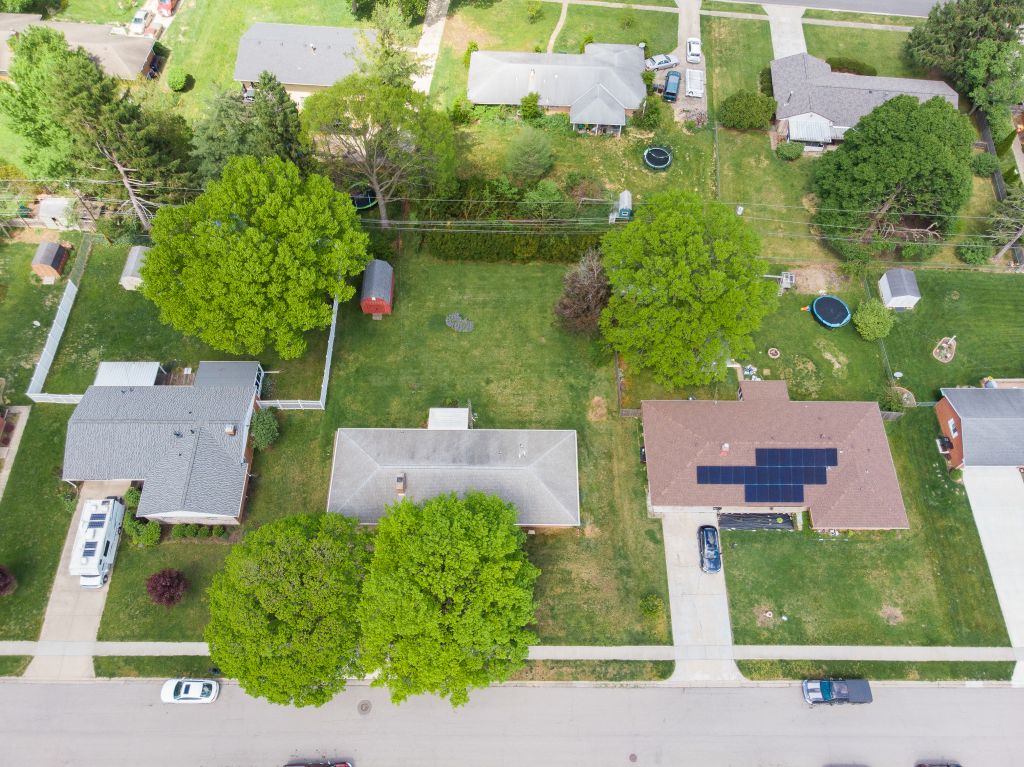 324 Beckenham Road Englewood, OH 45322 - Photo 25 of 26 An aerial view showcases a vibrant neighborhood with residential properties and expansive green yards.