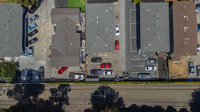 an aerial view of residential houses and outdoor space