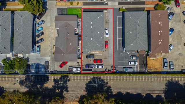 a swimming pool view with sitting space and garden view