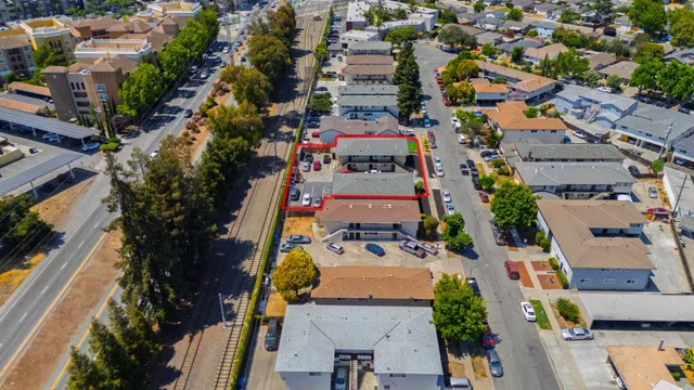an aerial view of residential houses with outdoor space