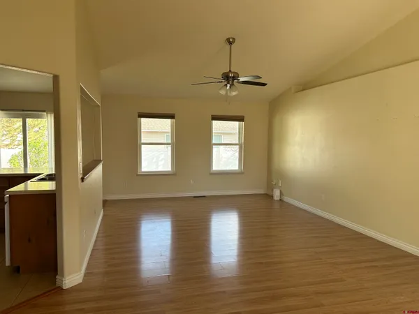 a kitchen with stainless steel appliances granite countertop a sink dishwasher stove top oven and refrigerator