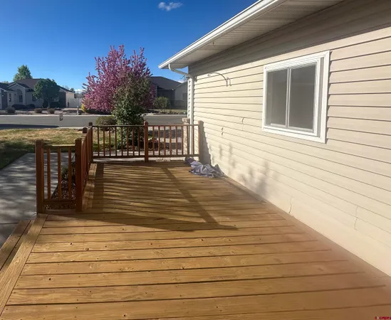 a front view of house with yard and outdoor seating