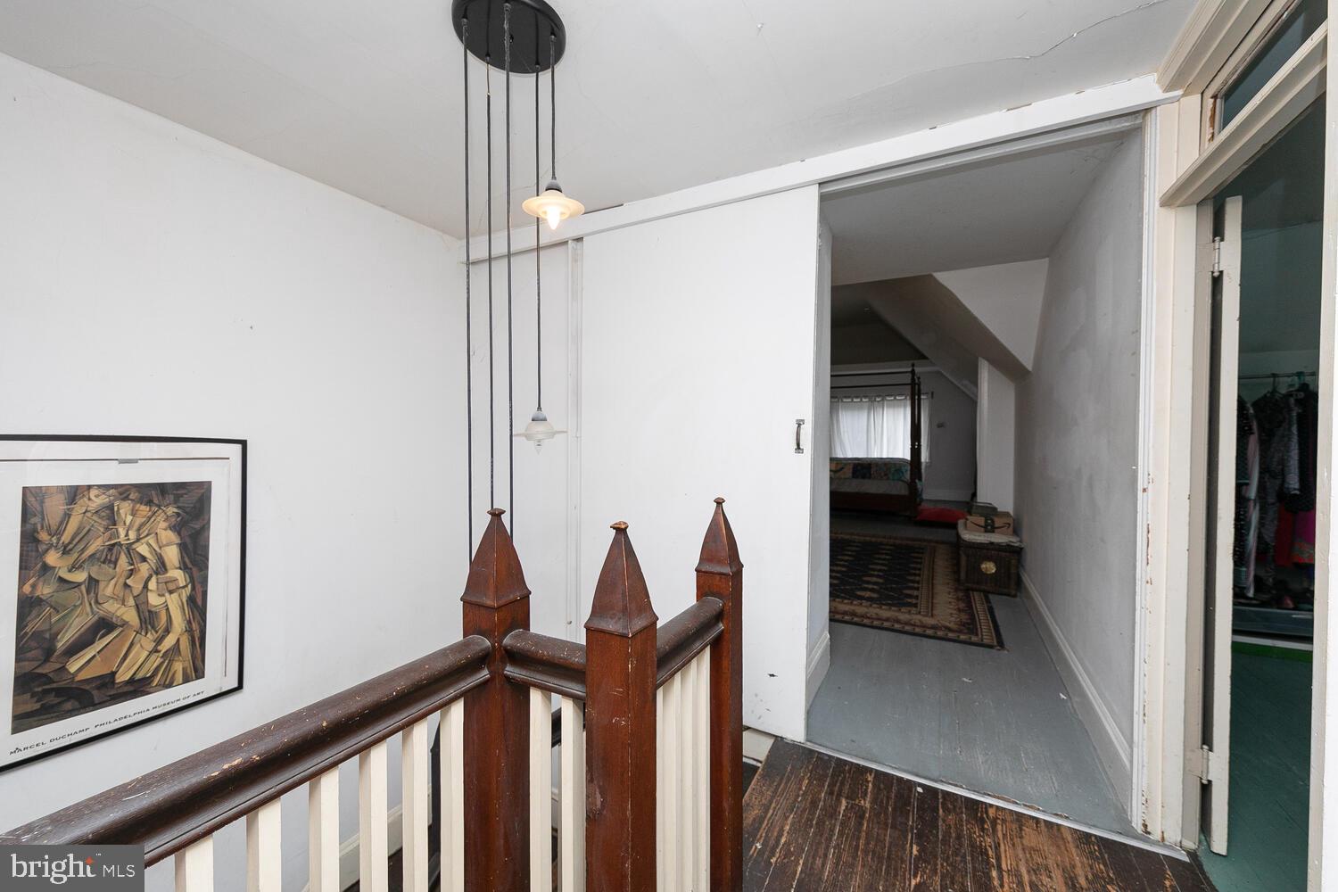 6705 Cresheim Road Philadelphia, PA 19119 - Photo 22 of 36 a view of a hallway to a livingroom with furniture