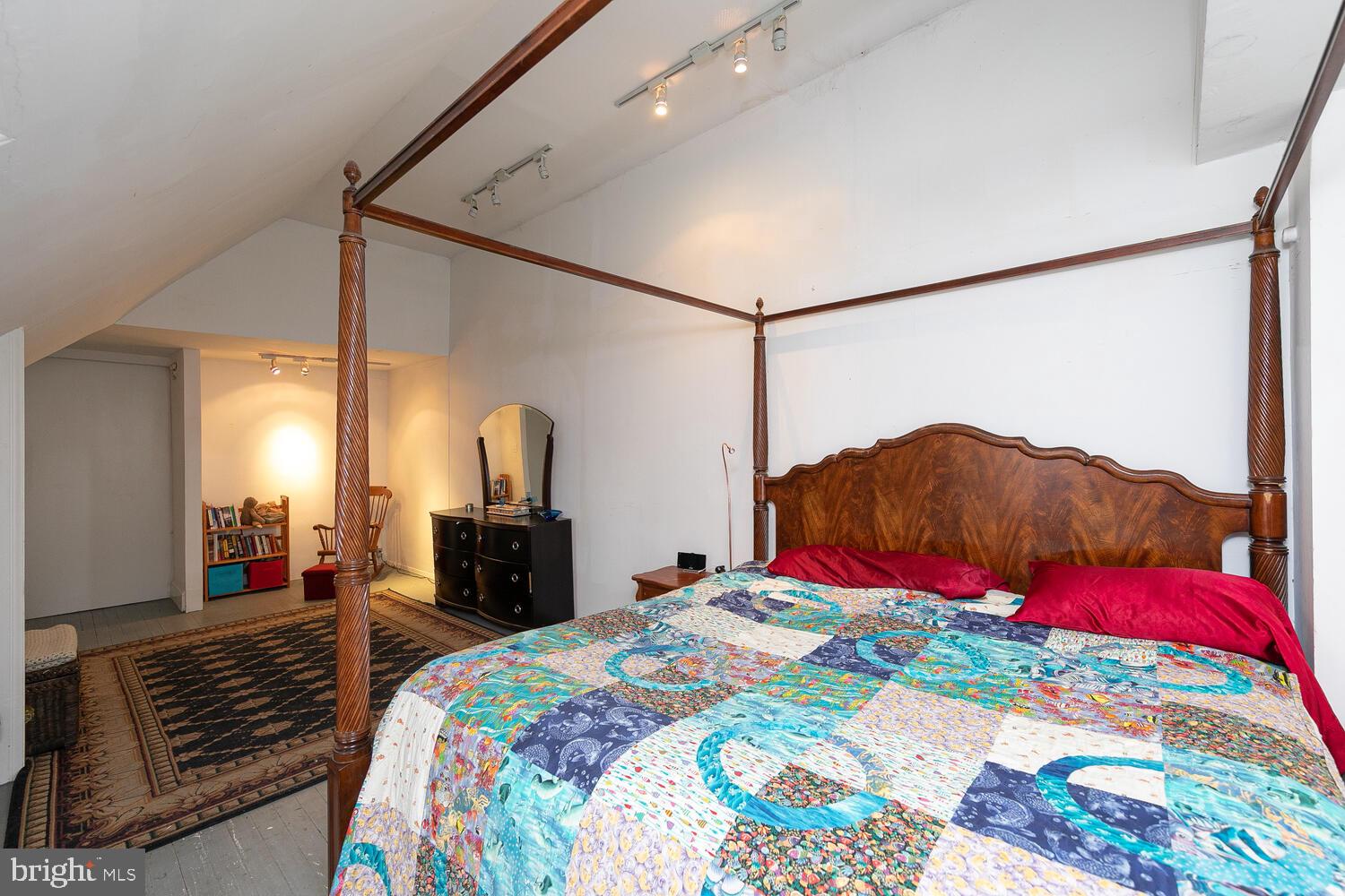 6705 Cresheim Road Philadelphia, PA 19119 - Photo 26 of 36 a bedroom with a bed and a chandelier