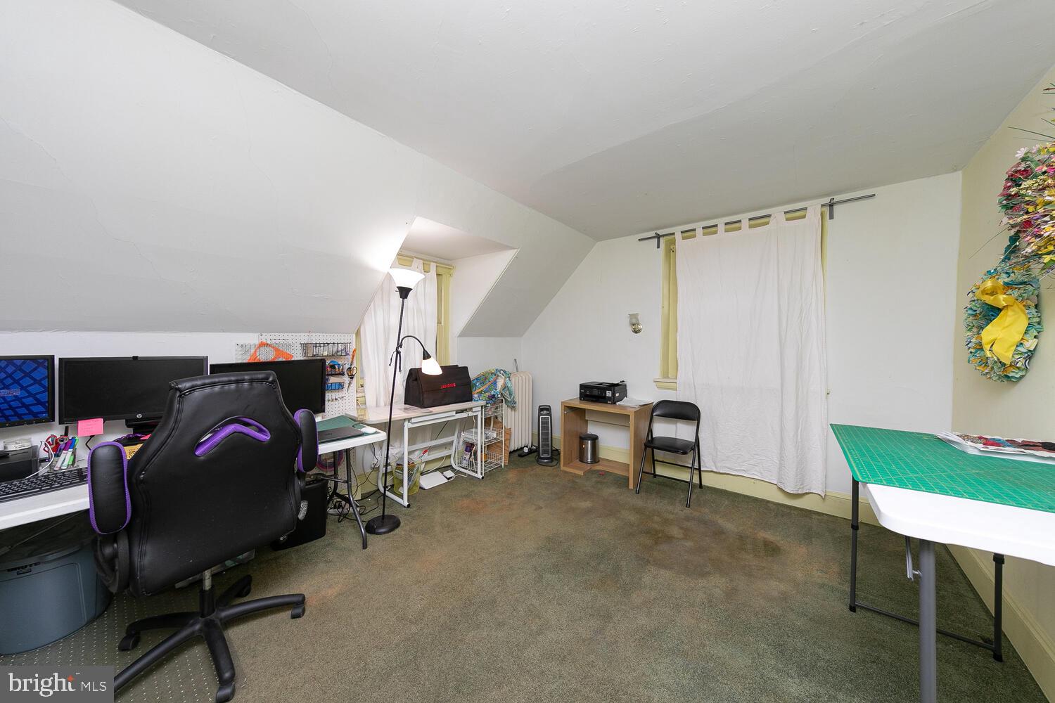 6705 Cresheim Road Philadelphia, PA 19119 - Photo 28 of 36 a bedroom with bed and a chair