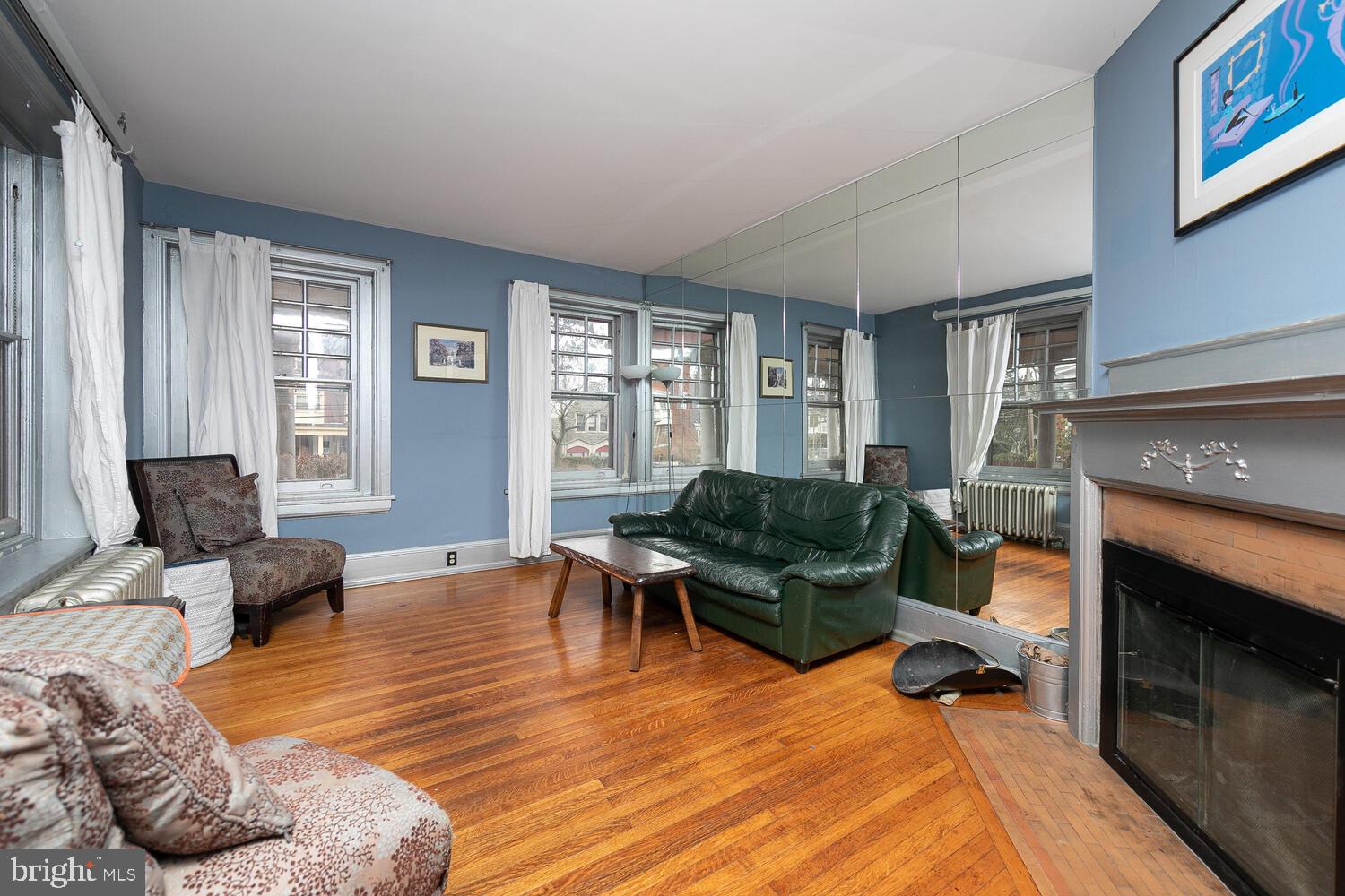 6705 Cresheim Road Philadelphia, PA 19119 - Photo 5 of 36 a living room with furniture rug and a fireplace