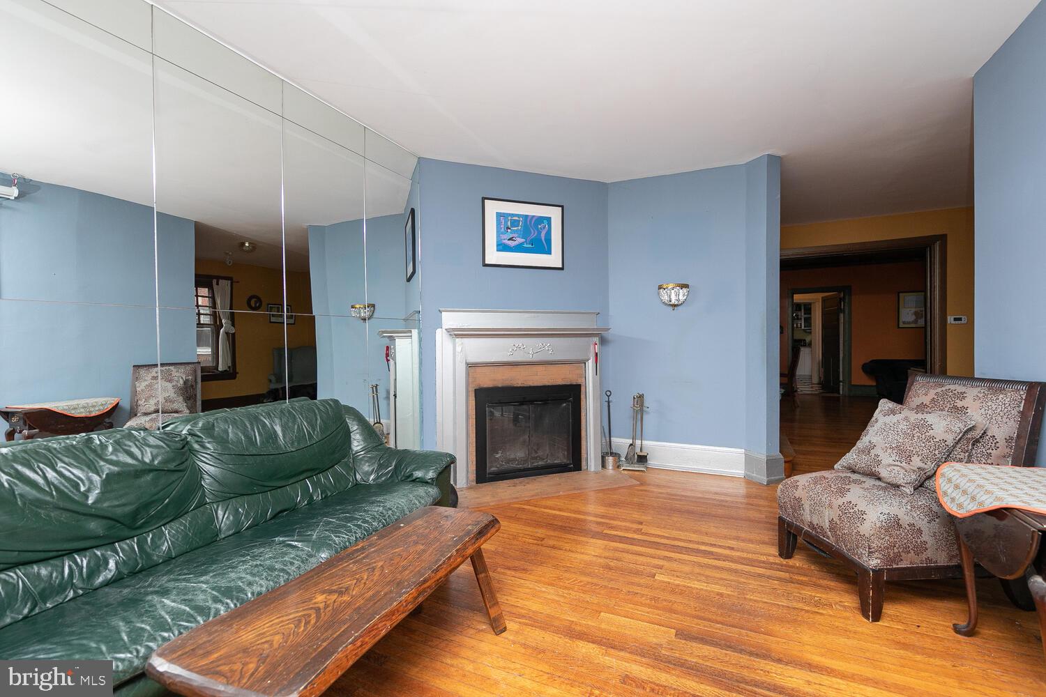 6705 Cresheim Road Philadelphia, PA 19119 - Photo 6 of 36 a living room with furniture and a fireplace