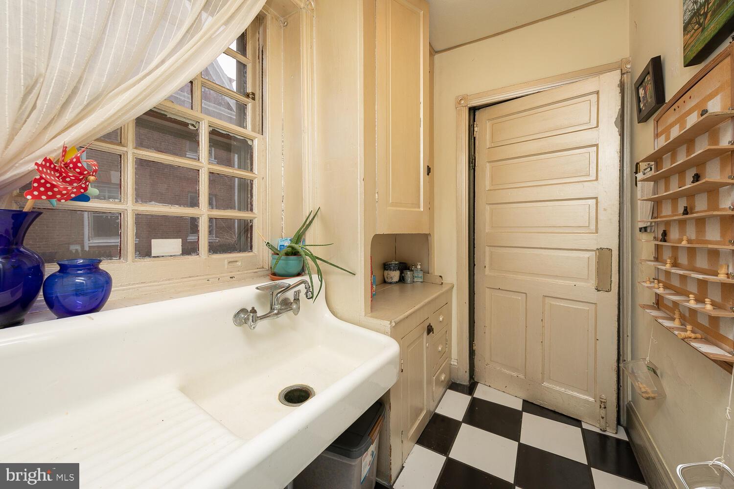6705 Cresheim Road Philadelphia, PA 19119 - Photo 9 of 36 a bathroom with a sink and a mirror