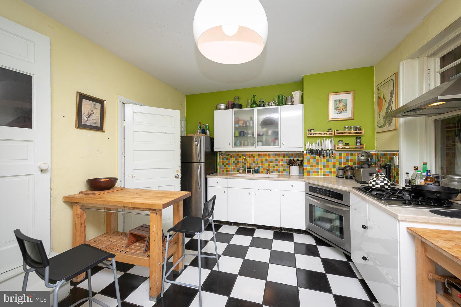 6705 Cresheim Road Philadelphia, PA 19119 - Photo 10 of 36 a kitchen with a sink a stove and a refrigerator