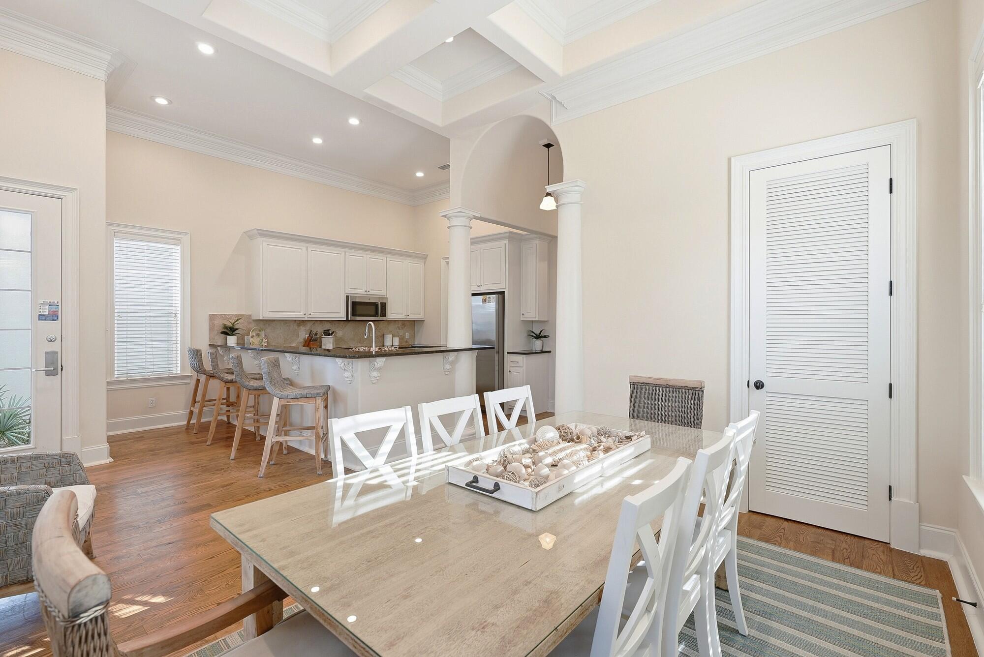 156 Palmeira Way Santa Rosa Beach, FL 32459 - Photo 15 of 58 a dining room with kitchen island a table and chairs