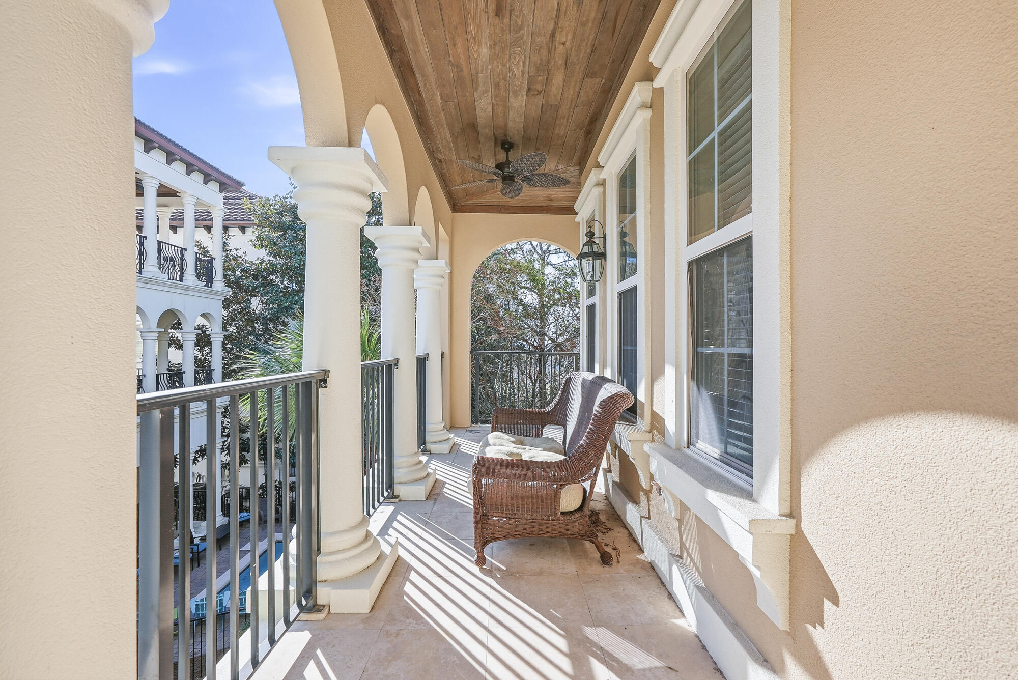 156 Palmeira Way Santa Rosa Beach, FL 32459 - Photo 24 of 58 a balcony with wooden floor and outdoor seating