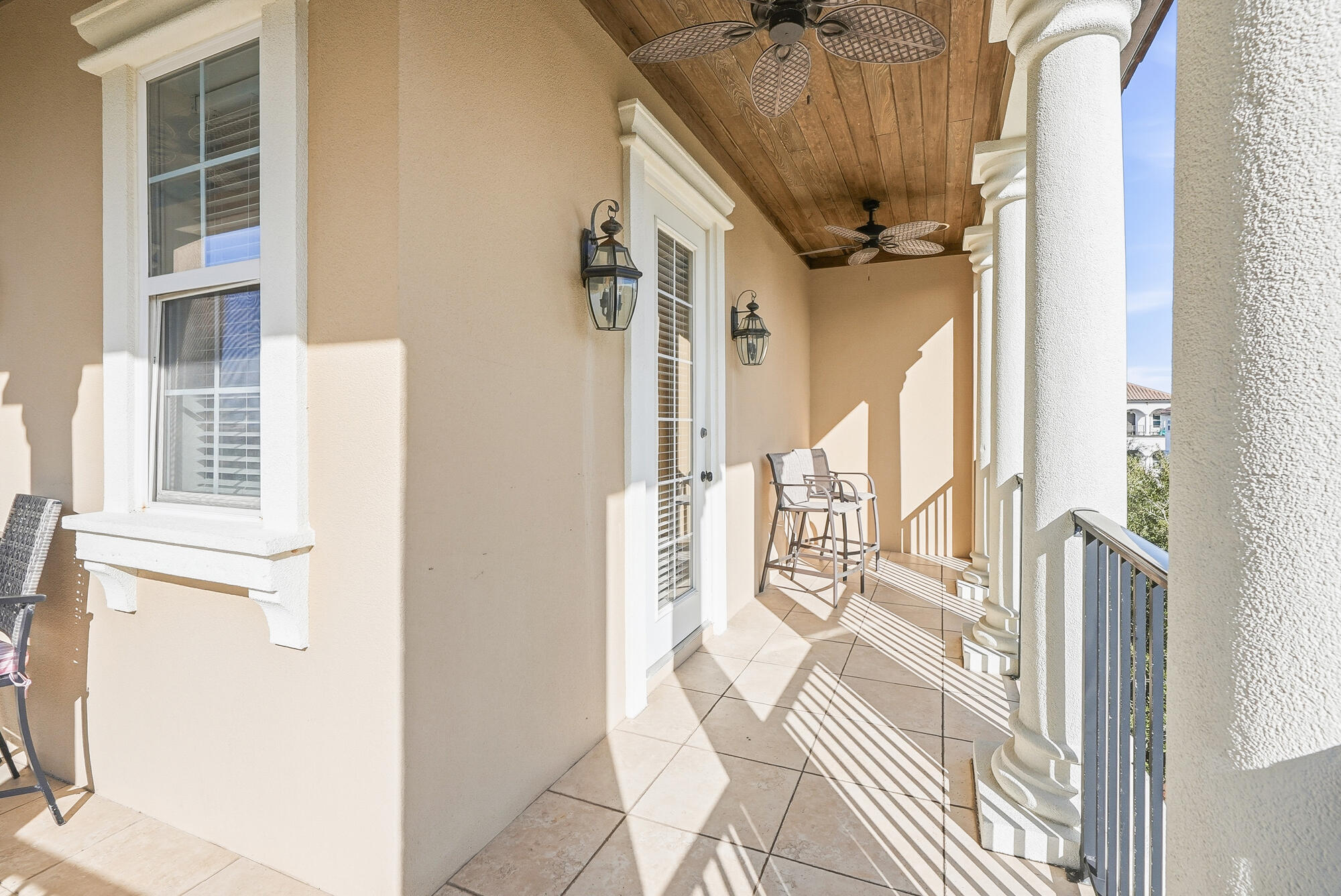 156 Palmeira Way Santa Rosa Beach, FL 32459 - Photo 39 of 58 a view of a balcony with wooden floor and furniture