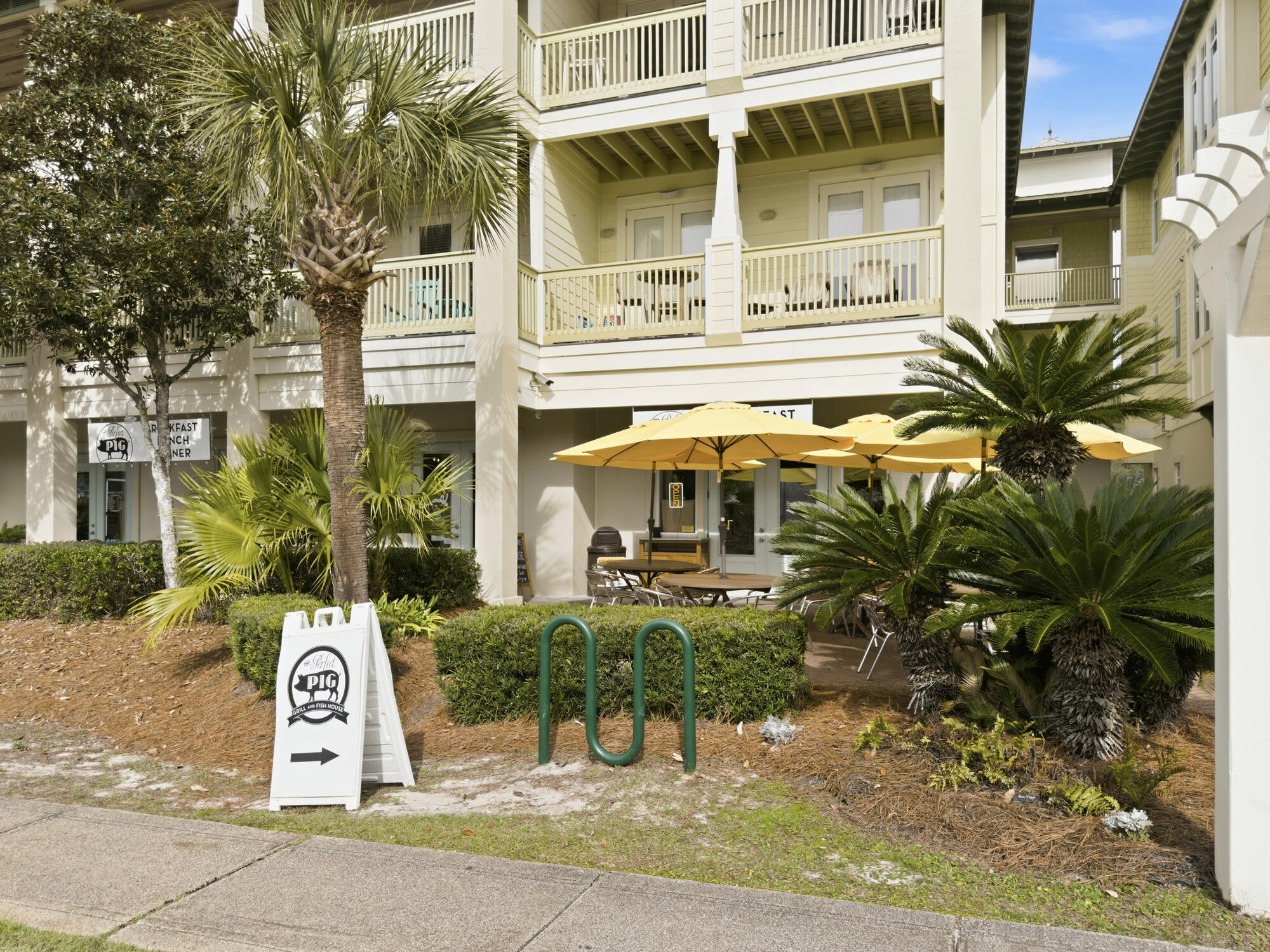 156 Palmeira Way Santa Rosa Beach, FL 32459 - Photo 51 of 58 a front view of a building with a garden
