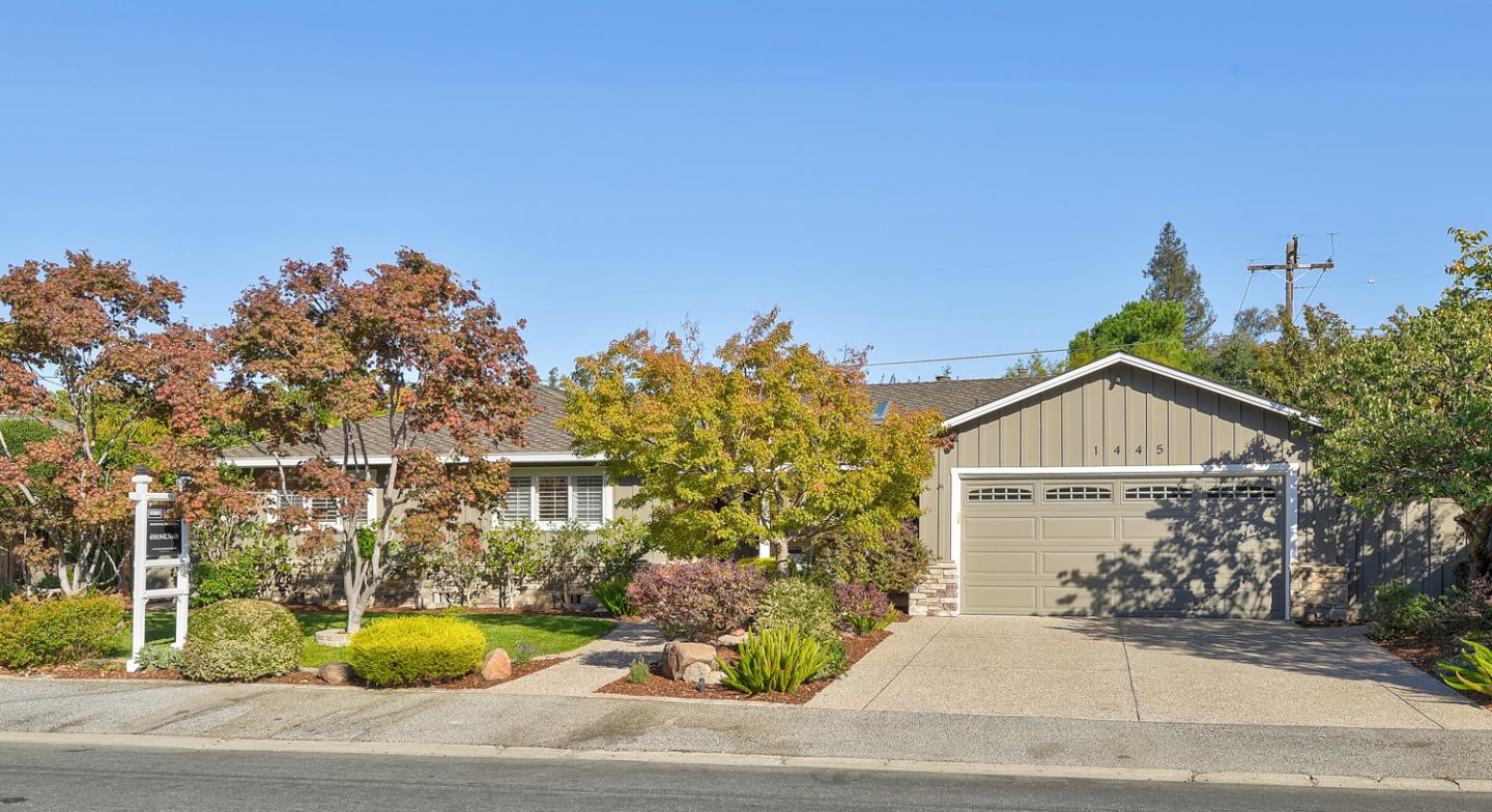 1445 Meadow Lane Mountain View, CA 94040 - Photo 1 of 33 a front view of a house with a yard and garage