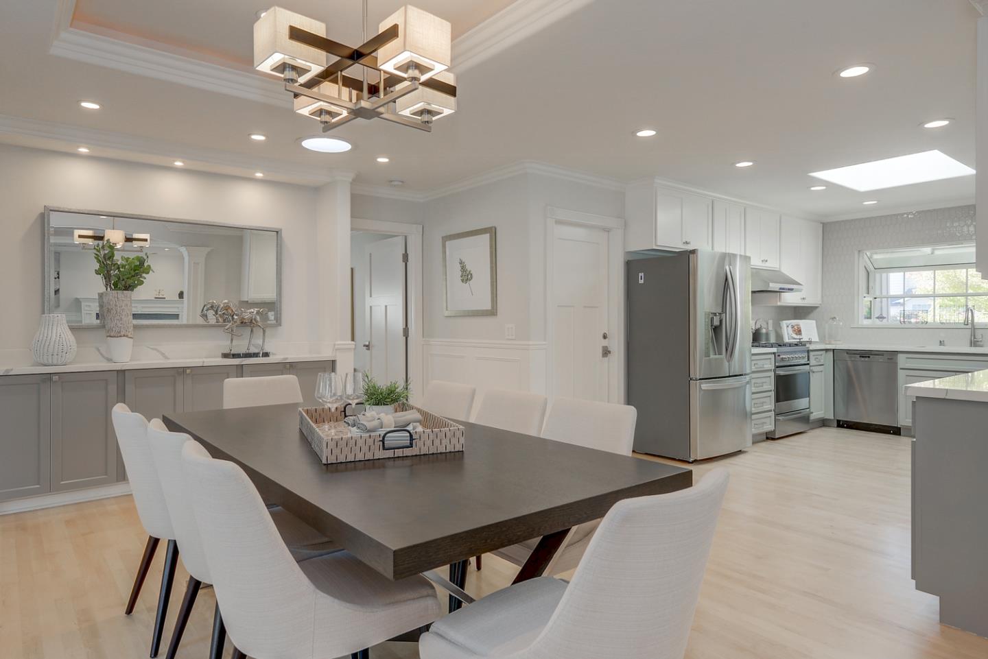 1445 Meadow Lane Mountain View, CA 94040 - Photo 14 of 33 a kitchen with stainless steel appliances kitchen island granite countertop a dining table chairs refrigerator and microwave