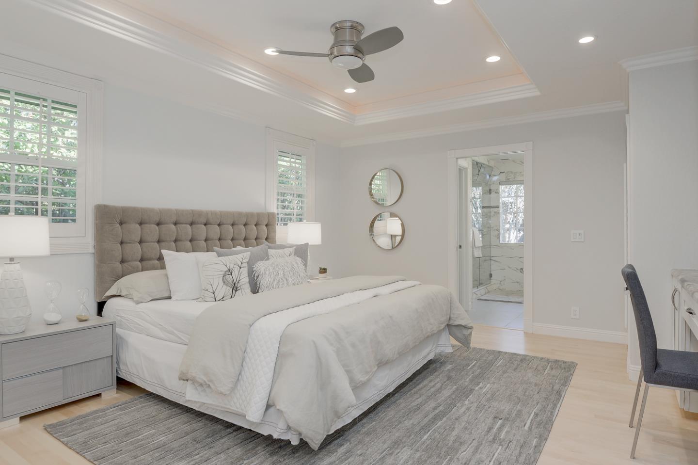 1445 Meadow Lane Mountain View, CA 94040 - Photo 18 of 33 a bedroom with a large bed and a chandelier