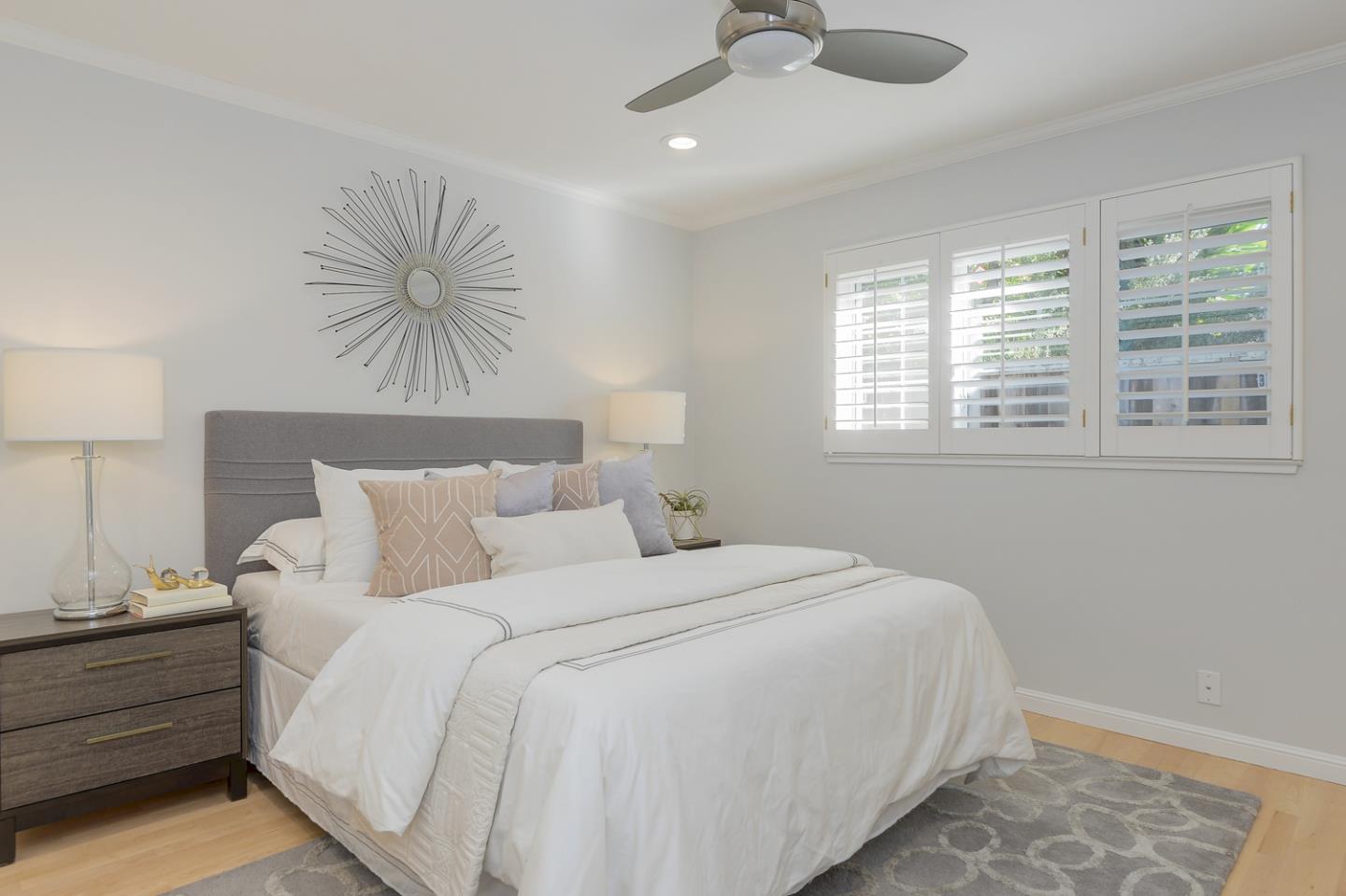 1445 Meadow Lane Mountain View, CA 94040 - Photo 23 of 33 a bed room with a bed and a chandelier
