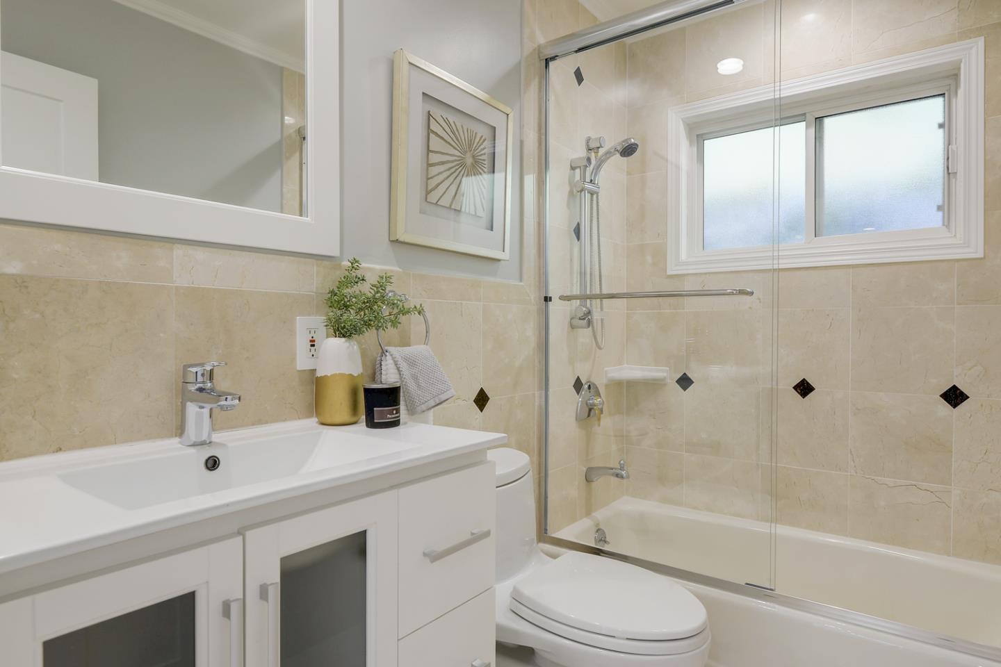 1445 Meadow Lane Mountain View, CA 94040 - Photo 25 of 33 a bathroom with a sink a toilet and shower