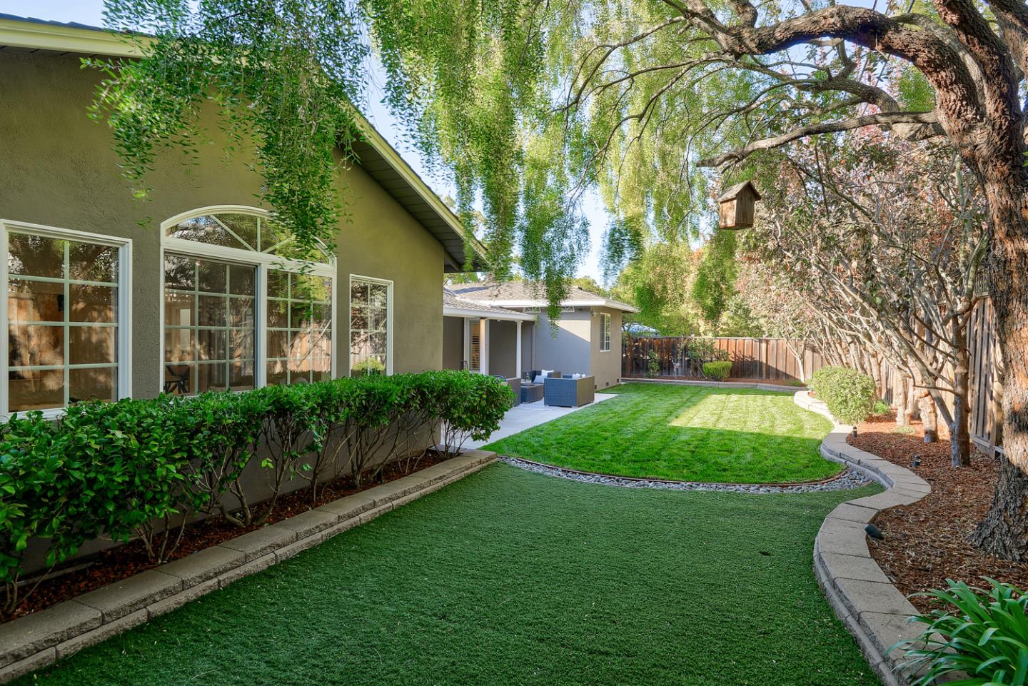 1445 Meadow Lane Mountain View, CA 94040 - Photo 31 of 33 a front view of a house with a garden and plants