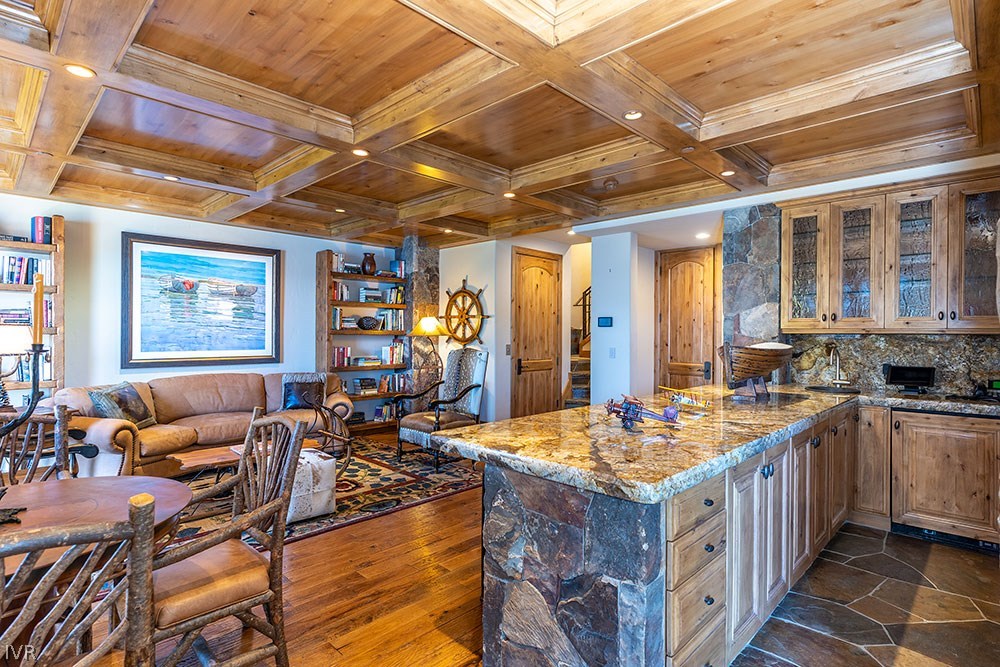 444 Gonowabie Road Crystal Bay, NV 89402 - Photo 18 of 35 a kitchen with a stove a sink dishwasher and a dining table with wooden floor