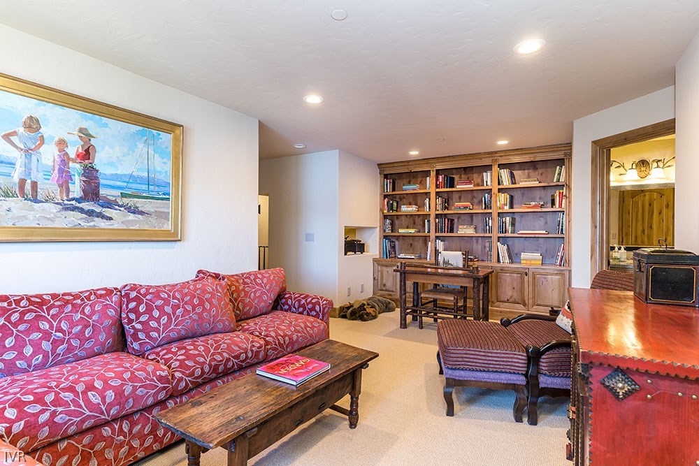 444 Gonowabie Road Crystal Bay, NV 89402 - Photo 23 of 35 a living room with furniture a rug and a bookshelf