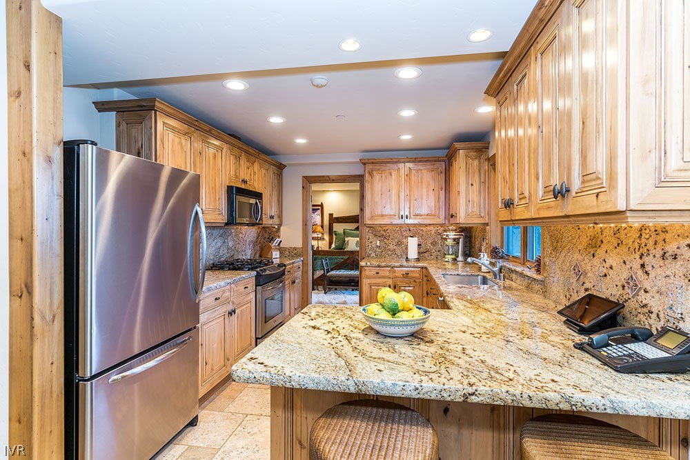 444 Gonowabie Road Crystal Bay, NV 89402 - Photo 27 of 35 a kitchen with a refrigerator sink and stove