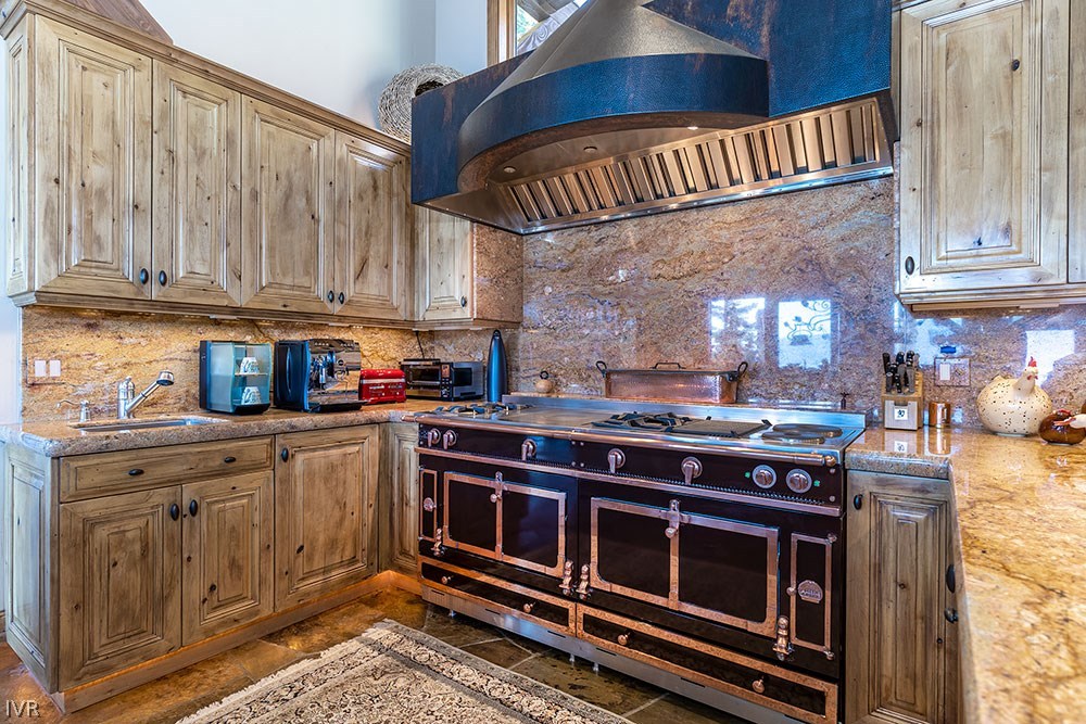 444 Gonowabie Road Crystal Bay, NV 89402 - Photo 9 of 35 a kitchen with stainless steel appliances granite countertop a stove and cabinets