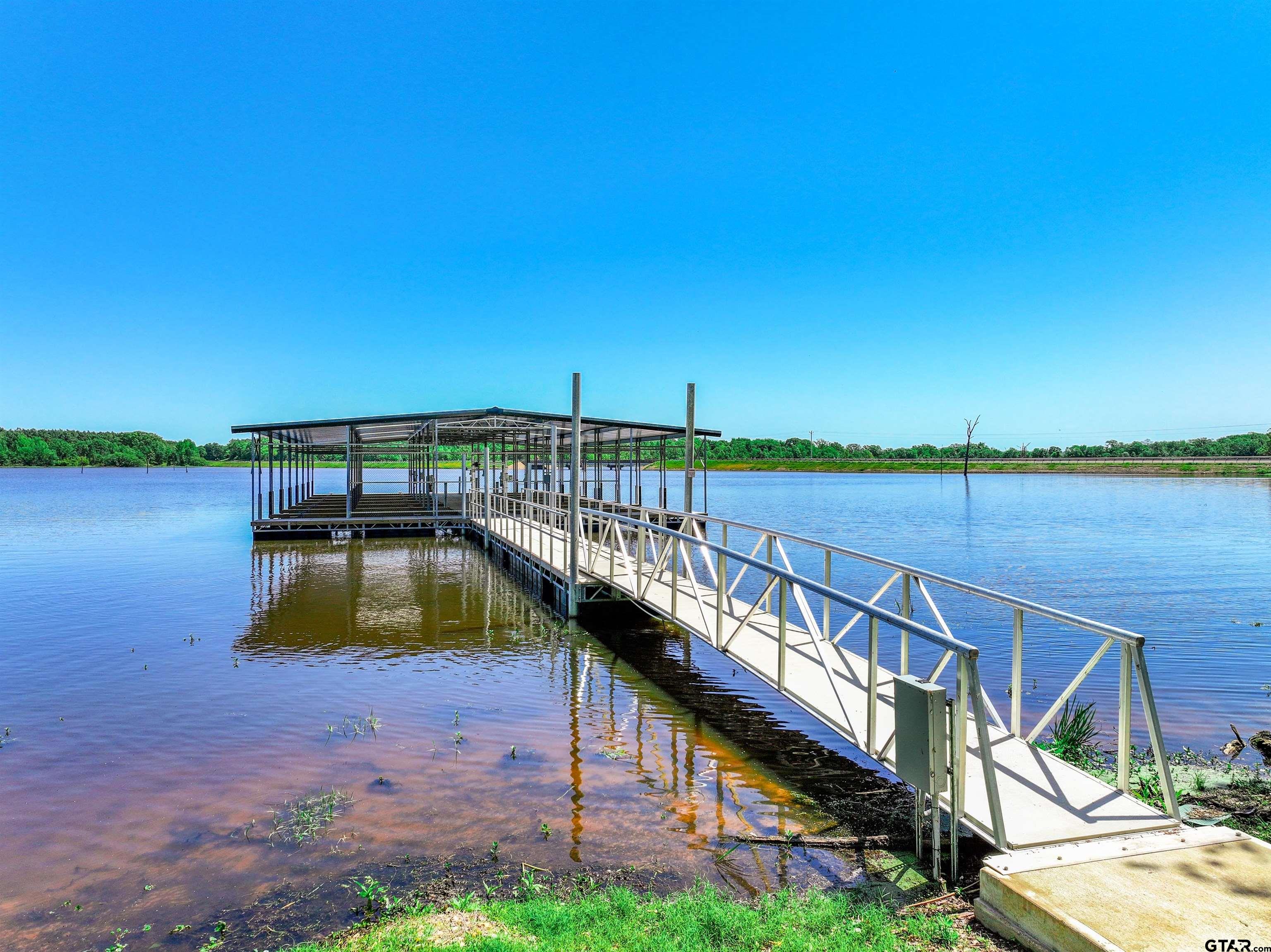5862 Yantis Tx 75497 Yantis, TX 75497 - Photo 15 of 23 a view of a lake with a deck