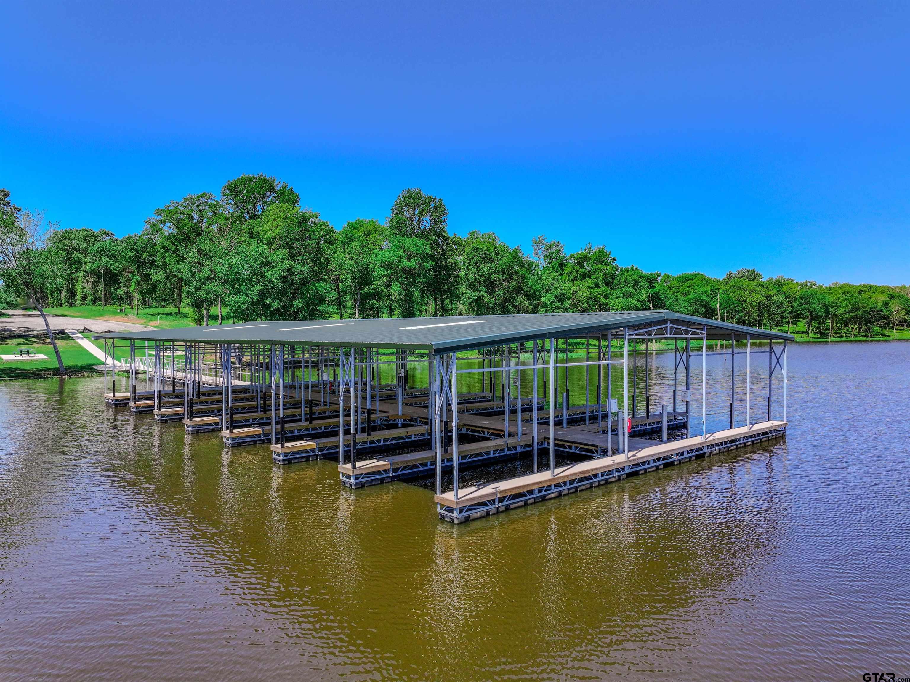 5862 Yantis Tx 75497 Yantis, TX 75497 - Photo 17 of 23 a view of a swimming pool with a lake view