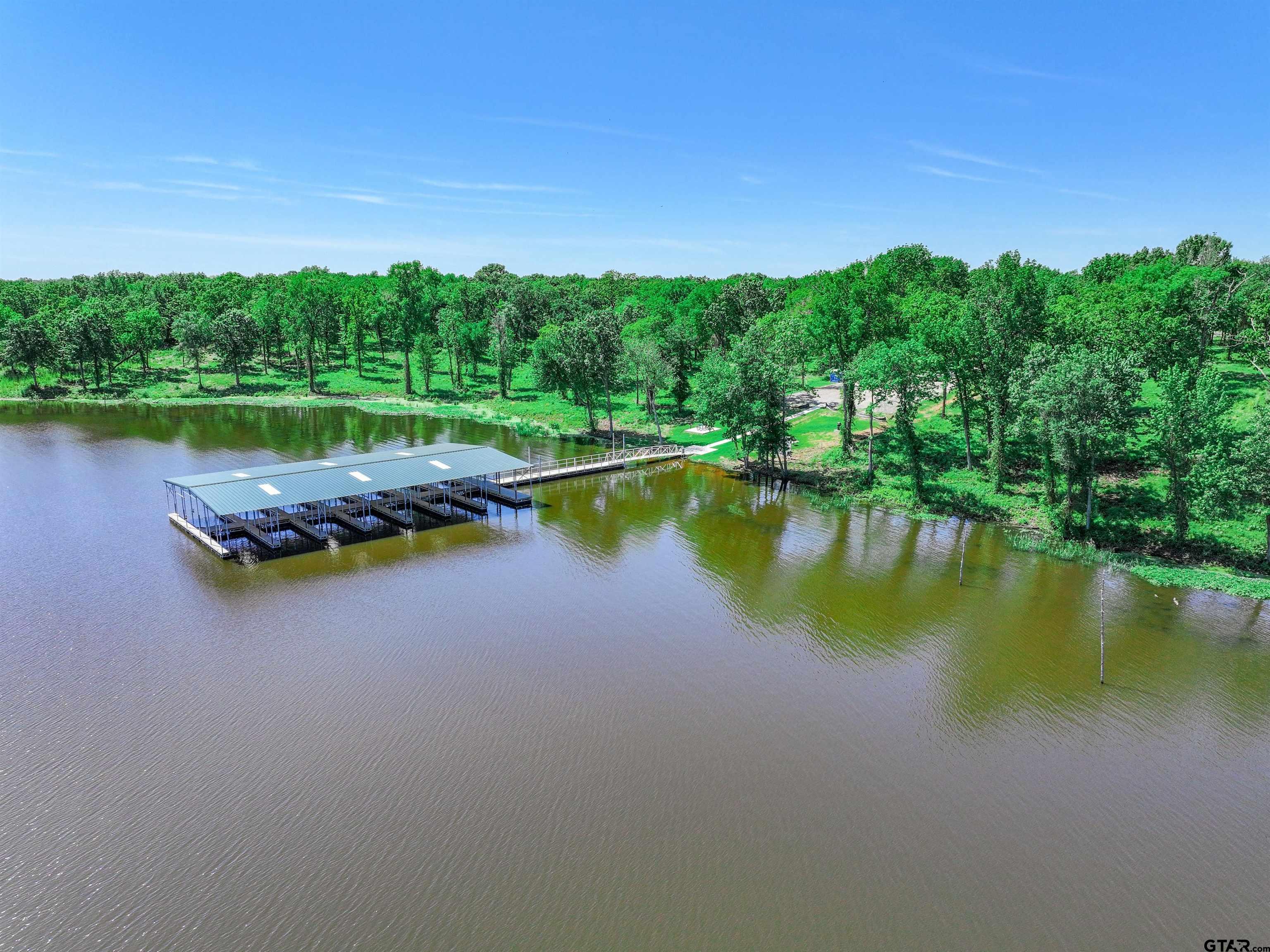 5862 Yantis Tx 75497 Yantis, TX 75497 - Photo 20 of 23 a view of a lake with houses in the background