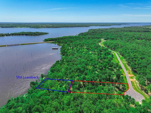 a view of a lake with a yard